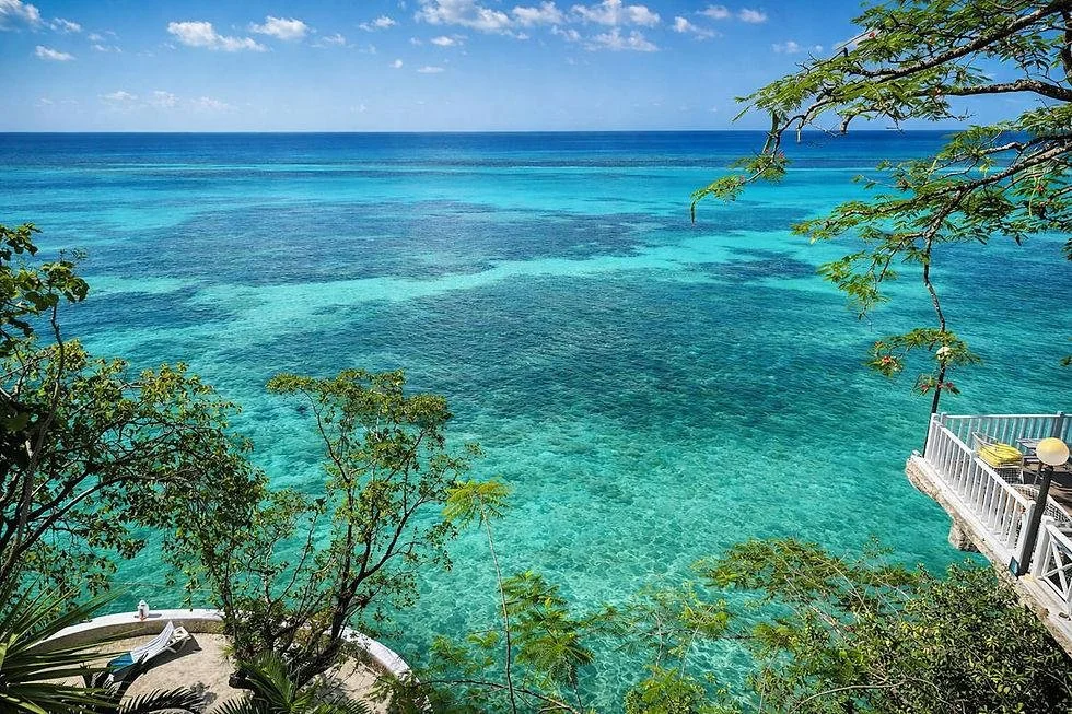 Lush tropical greenery overlooking the Caribbean coastline near Ocho Rios, Jamaica.