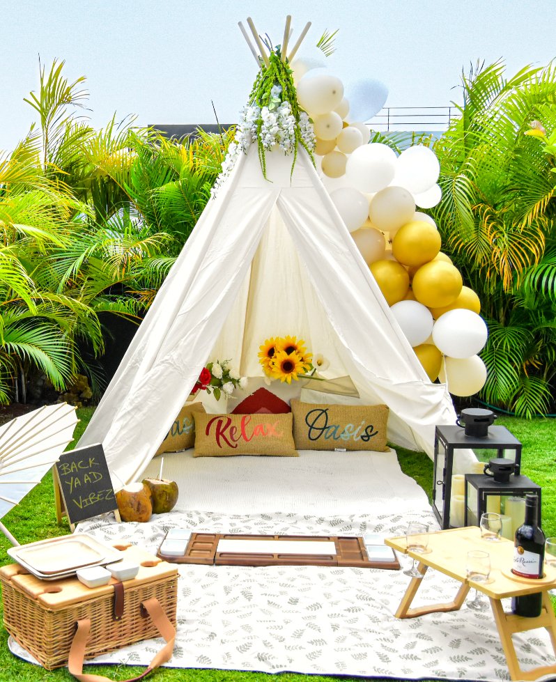 Private garden picnic setup with tropical greenery and elegant décor at Luxe Oasis in Ocho Rios, Jamaica
