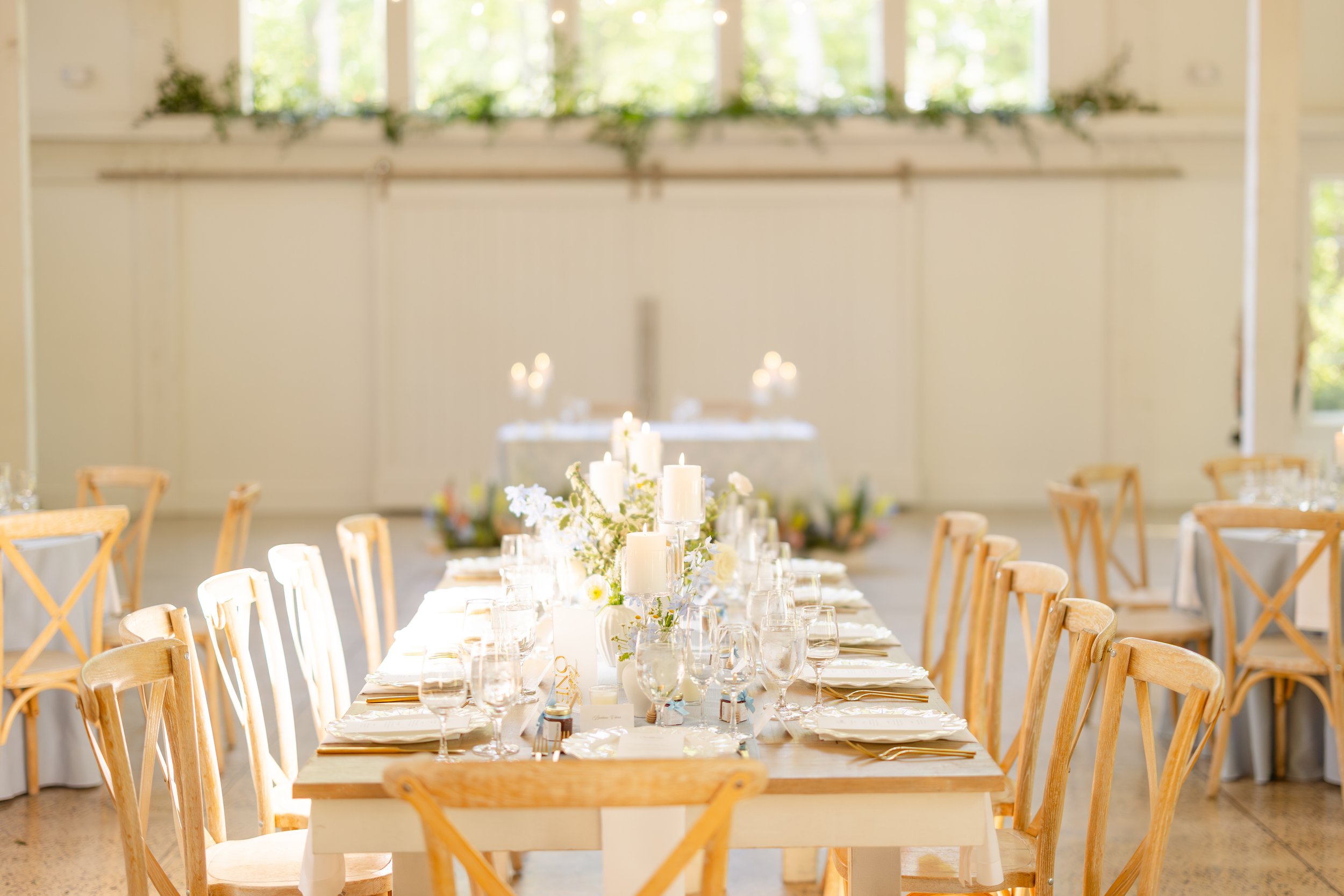 Carolina Grove greenery over windows sweetheart table aisle flowers.JPG