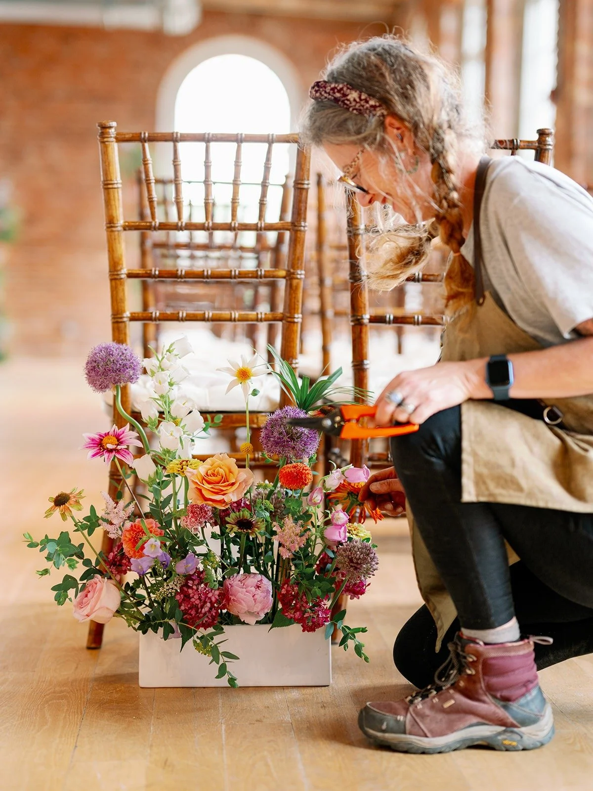 Lisa setting up aisle ags Cotton Room wedding.jpg