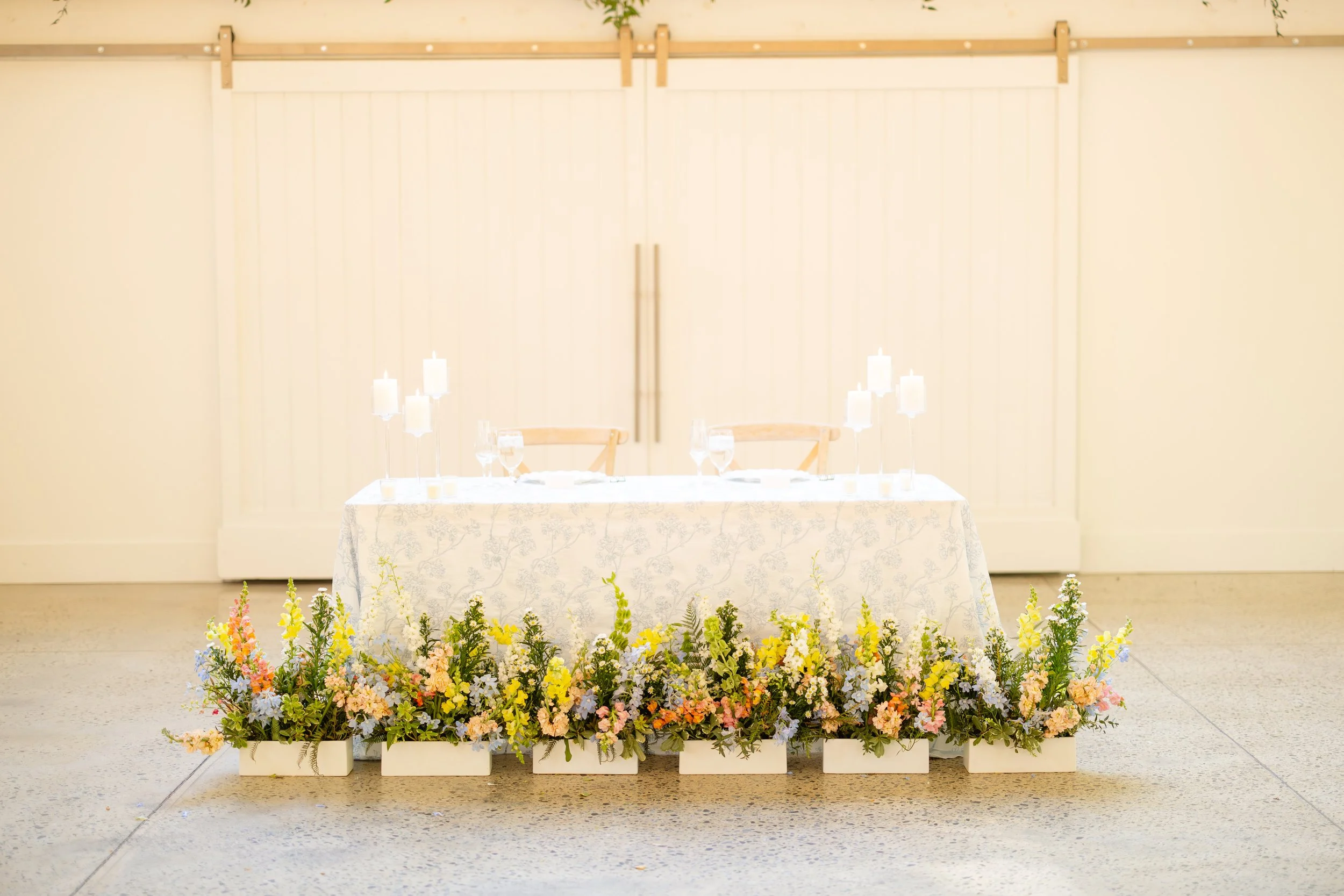 Carolina Grove repurposed meadow boxes aisle flowers H and N.JPG