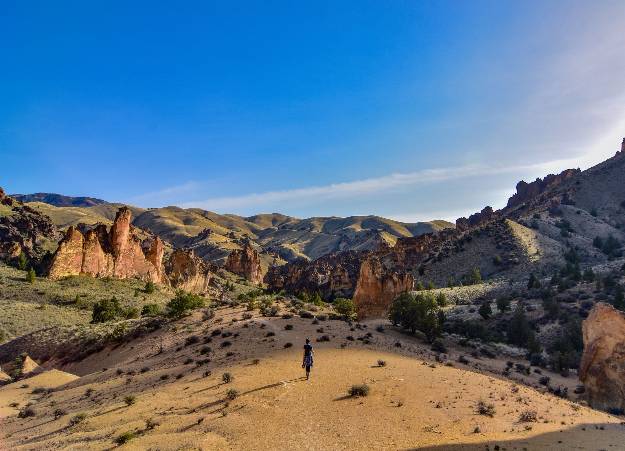 Emily hikes among Oregon red rock formations