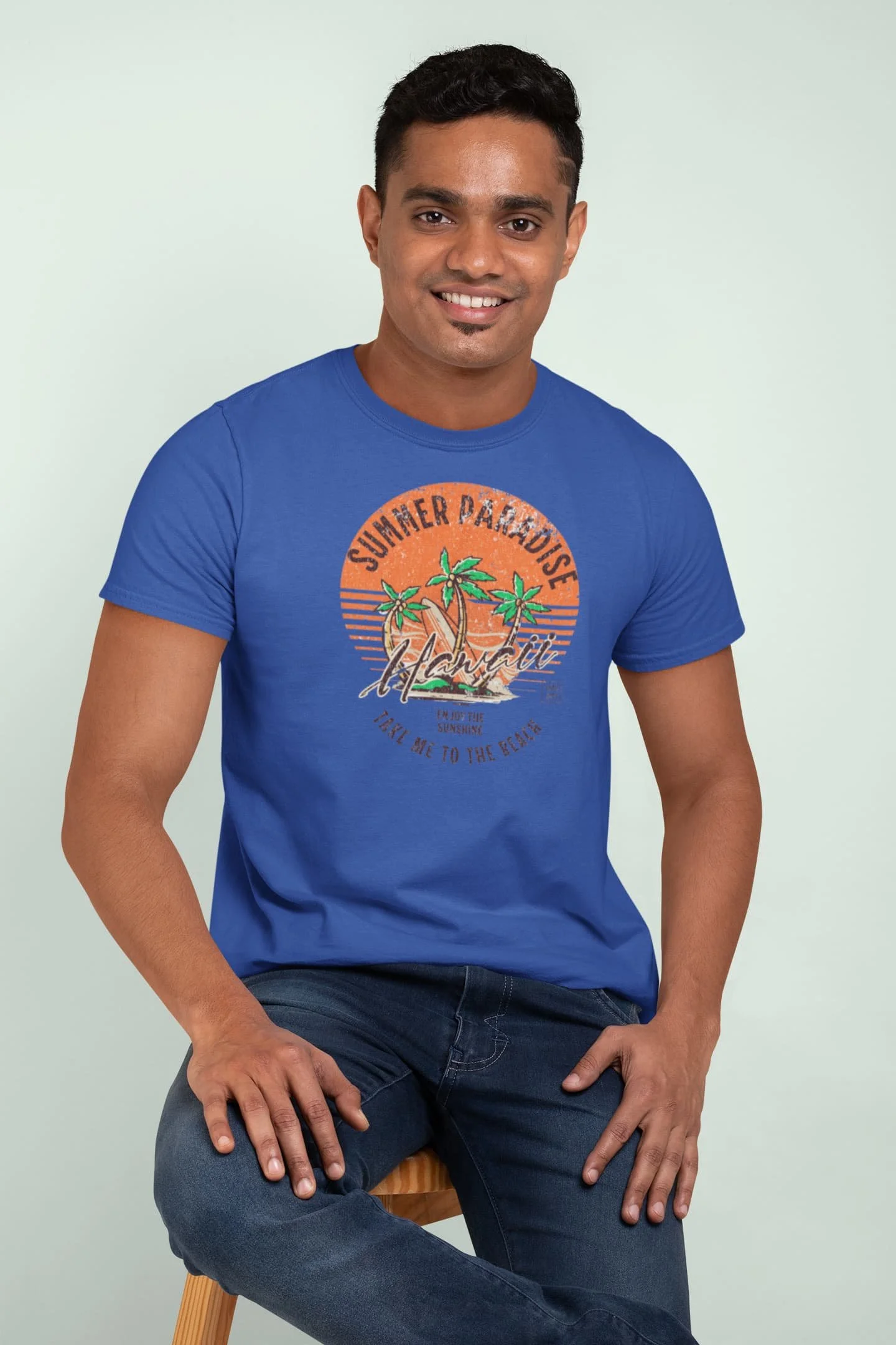 True Royal blue Summer Paradise t-shirt mockup of a man smiling at a studio @jellybzz.com
