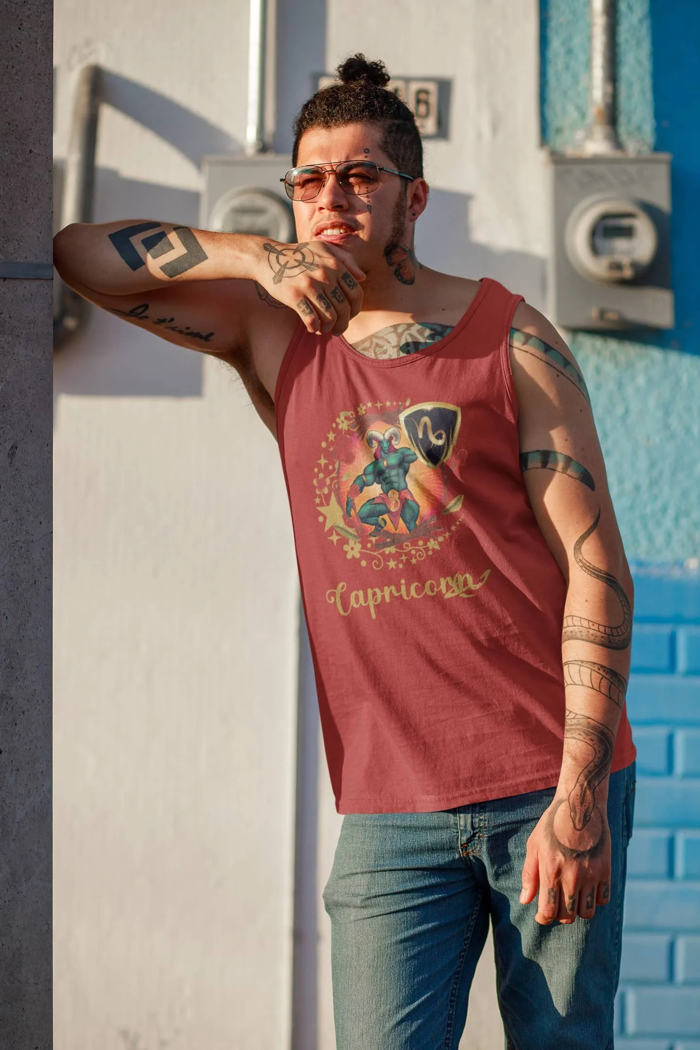 Red Capricorn tank top mockup of a tattooed man with a hair bun @jellybzz.com.