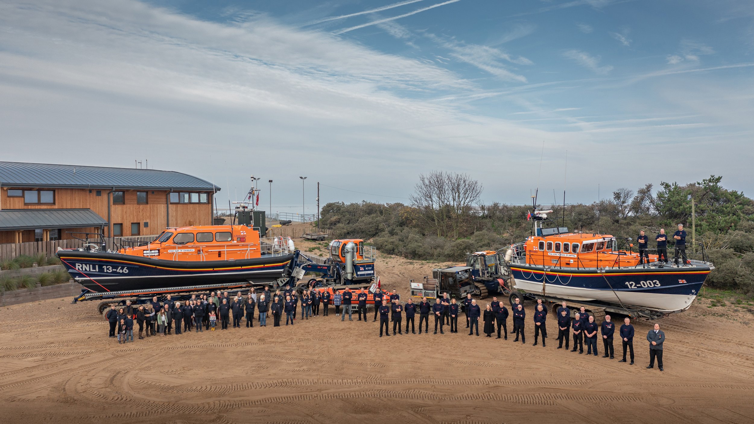  The Wells RNLI family with both all-weather boats, the inshore-lifeboat (the D-Class, in the middle) and the three different launching systems. 