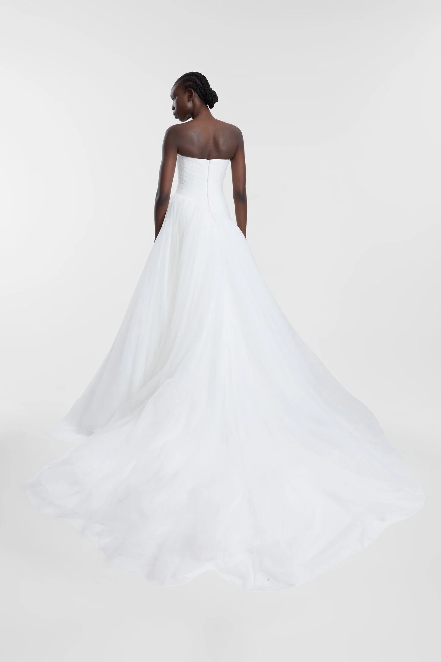 A lesson in soft layering via Pippi. Celebrating the female form in swathes of ivory tulle, Pippi delivers high impact thanks to its striking ballgown silhouette, sweetheart neckline and textured draping at the waistline. Rewriting the bridal codes o