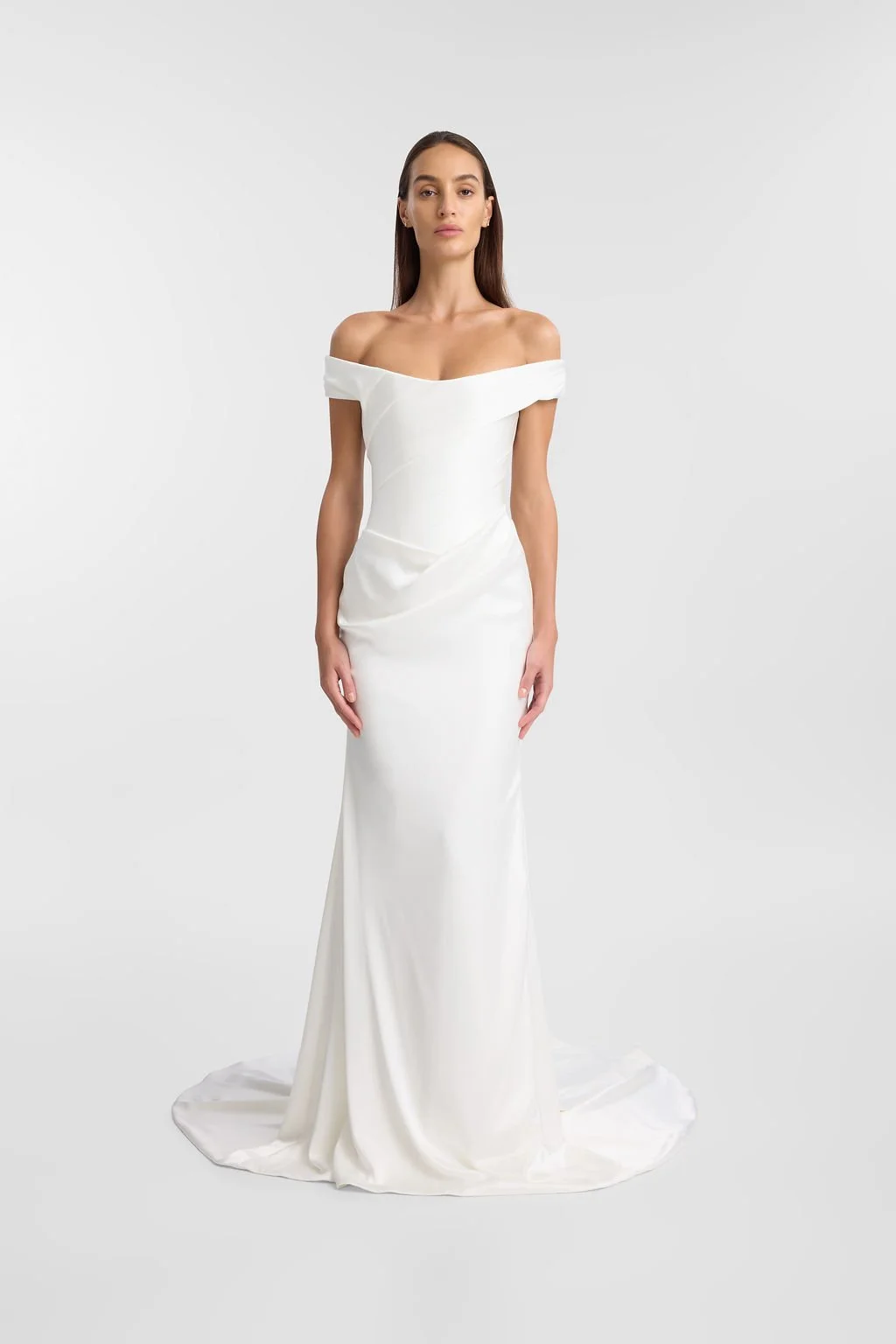 Irreverent glamour takes the spotlight in KYHA Bride Nia. Cut from sleek double satin, Nia features a highly structured bodice with a tight drape and a fit-and-flare skirt cut to accentuate the silhouette. The draping graciously falls into a floor-sw