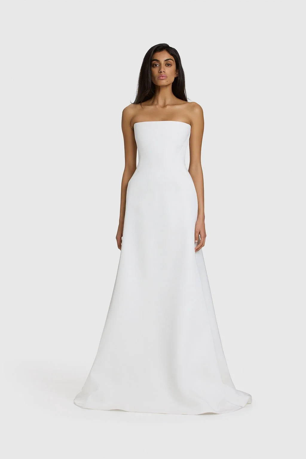 A work of art in KYHA Bride Walkley. Cut from fluid triacetate with a hint of stretch, Walkley’s A-line silhouette features a corseted bodice and liquid-like skirt that gracefully trails behind. The architectural hip detail combining sculptural shapi