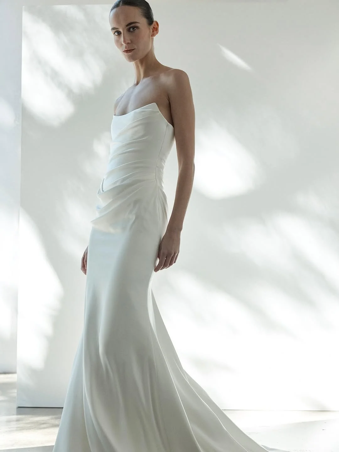 draping becomes an art form in KYHA Bride Iver. a structured, scoop neckline bodice cinches the waistline and a fit-and-flare skirt celebrates the female form. but the star of the showstopping KYHA Bride Iver is its draping. tight and directional acr