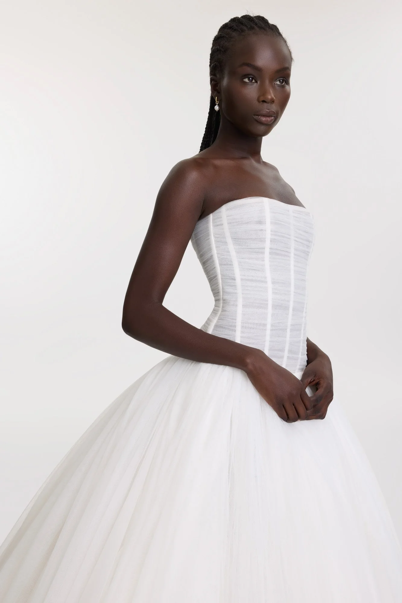 Balletcore energy en pointe via KYHA Bride Beau. Its structured, dropped waist bodice is artfully draped with soft tulle, but it’s the full, gathered skirt that delivers the kind of drama that is usually reserved for the stage