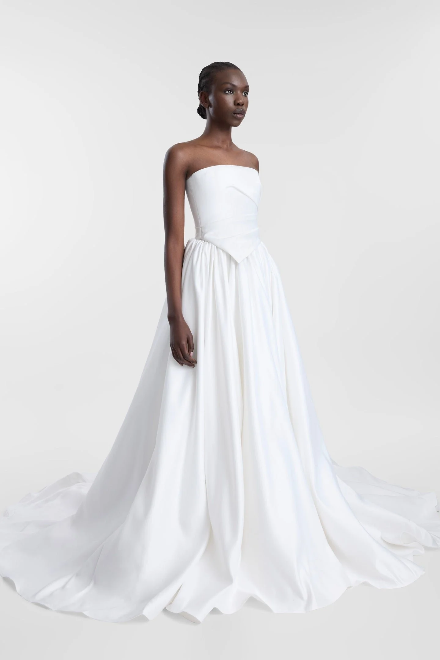 The way to win bridal style is in two parts, first via Vara. Spirit of the 70s captured via its scarf-detailed hem, Vara is a structured corset crafted from luxe duchess satin. Cut for a close fit, Vara features a modern straight neckline and soft or