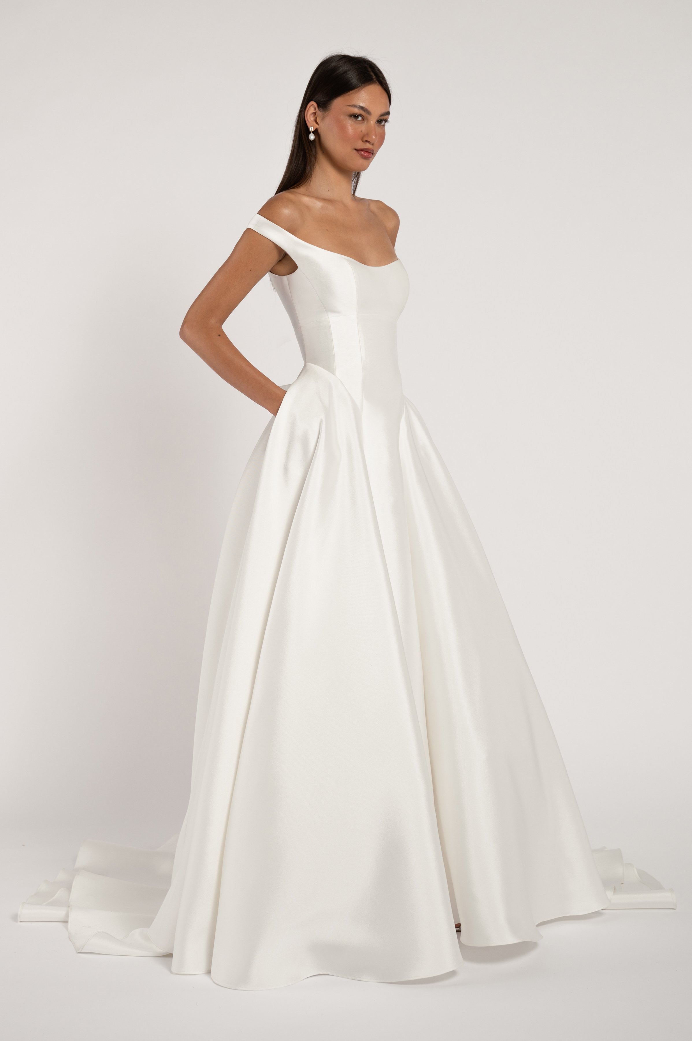 The Jenny Yoo Bridal Alyne gown is a classic beauty. The corseted bodice wraps gracefully around your shoulders while the dramatic skirt adds romance and drama. Available at Halo & Wren Bridal.

Details
Sleek Mikado fabric
Fully boned bodice
Bust cup