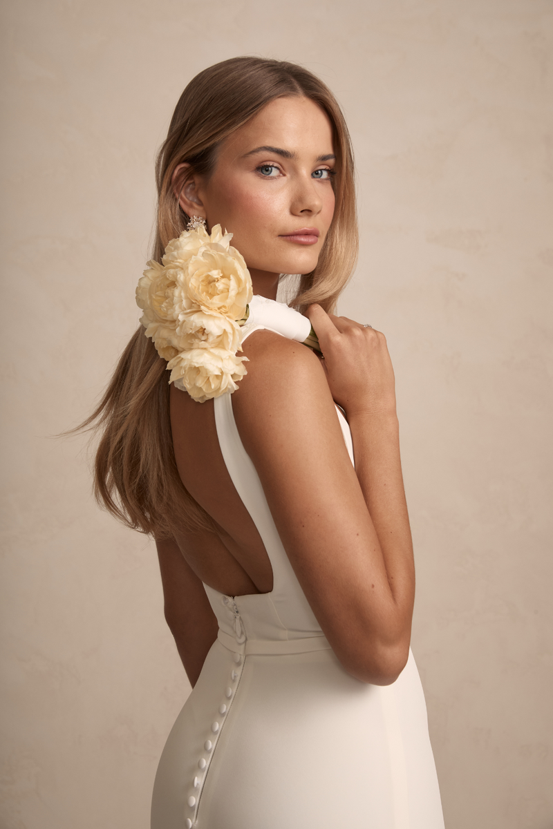 MWL Hunter features a highly requested square neckline, illusion tulle cut-outs, and a higher square back with figure-flattering buttons. Crafted from iconic French crepe, this design beautifully frames the bust, offering a flattering look for all MW