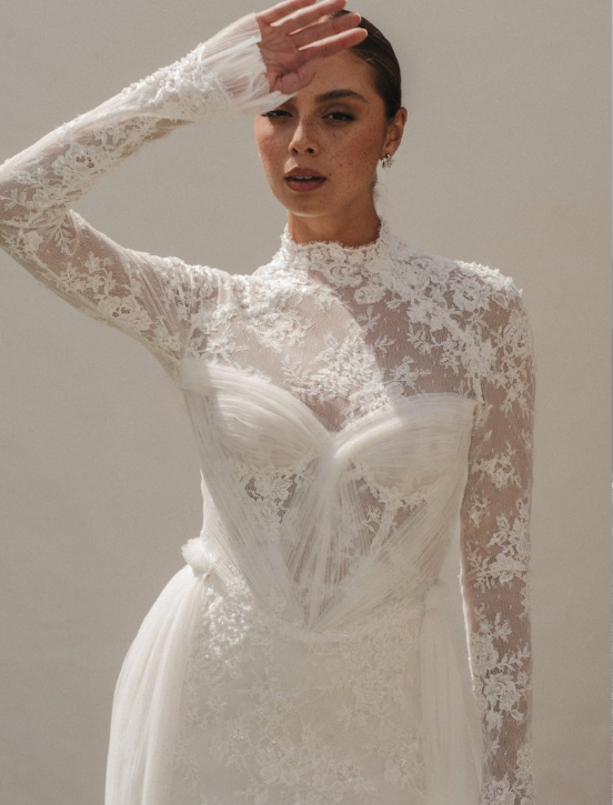 Alena Leena Bridal Rubinette available at Halo & Wren Bridal

The Rubinette gown is demurely flirtatious with a hint of seduction. A structured bustier is softened by swathes of lace, and hints of sparkle shine as you move.

Perfect for the bride loo