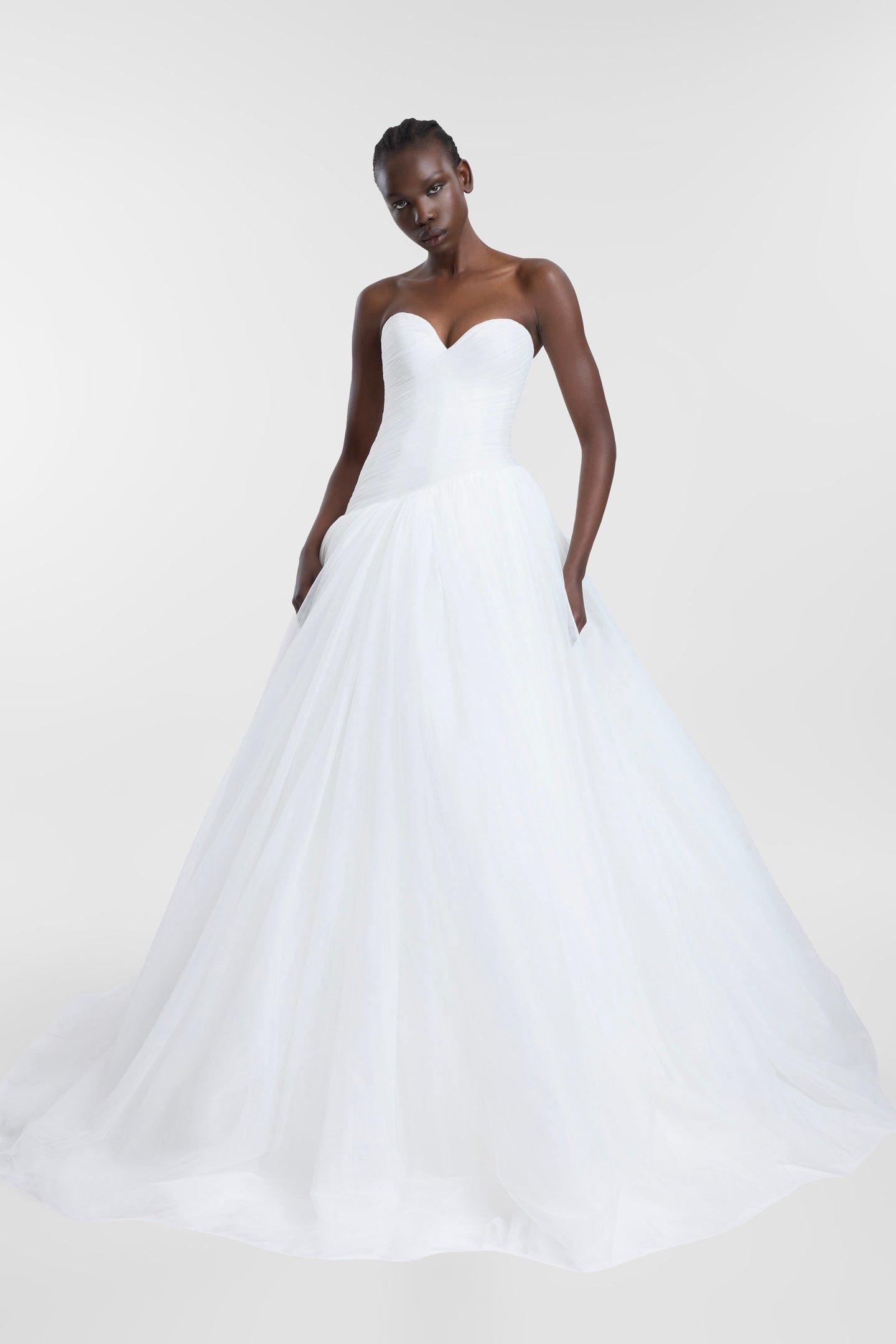 A lesson in soft layering via Pippi. Celebrating the female form in swathes of ivory tulle, Pippi delivers high impact thanks to its striking ballgown silhouette, sweetheart neckline and textured draping at the waistline. Rewriting the bridal codes o