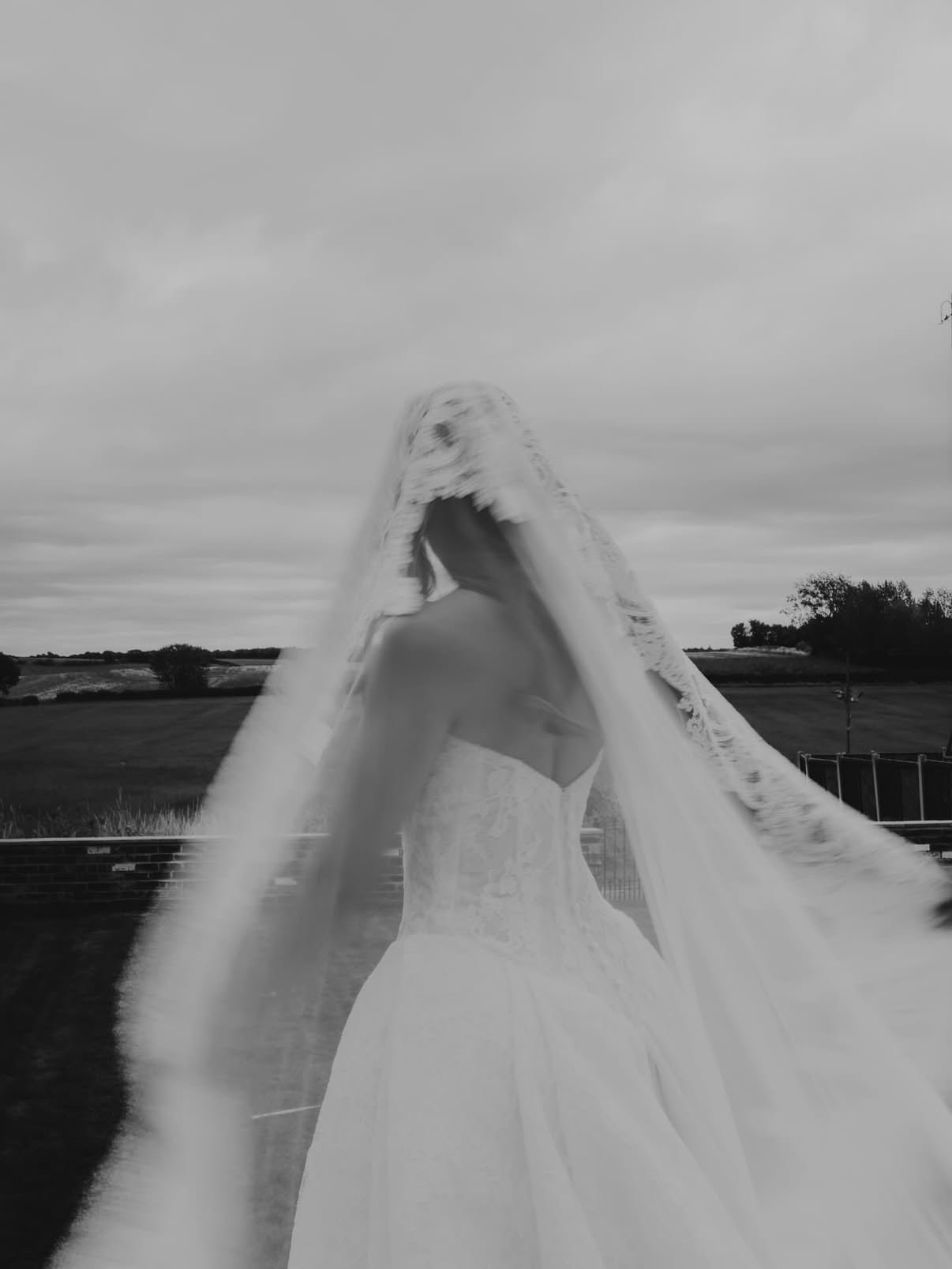 Prepare to travel world in the Mariana Hardwick Vienna bridal gown. This stunning gown features a sheer dropped waist bodice made from delicate corded lace while the full pleated skirt creates a dramatic and voluminous silhouette.