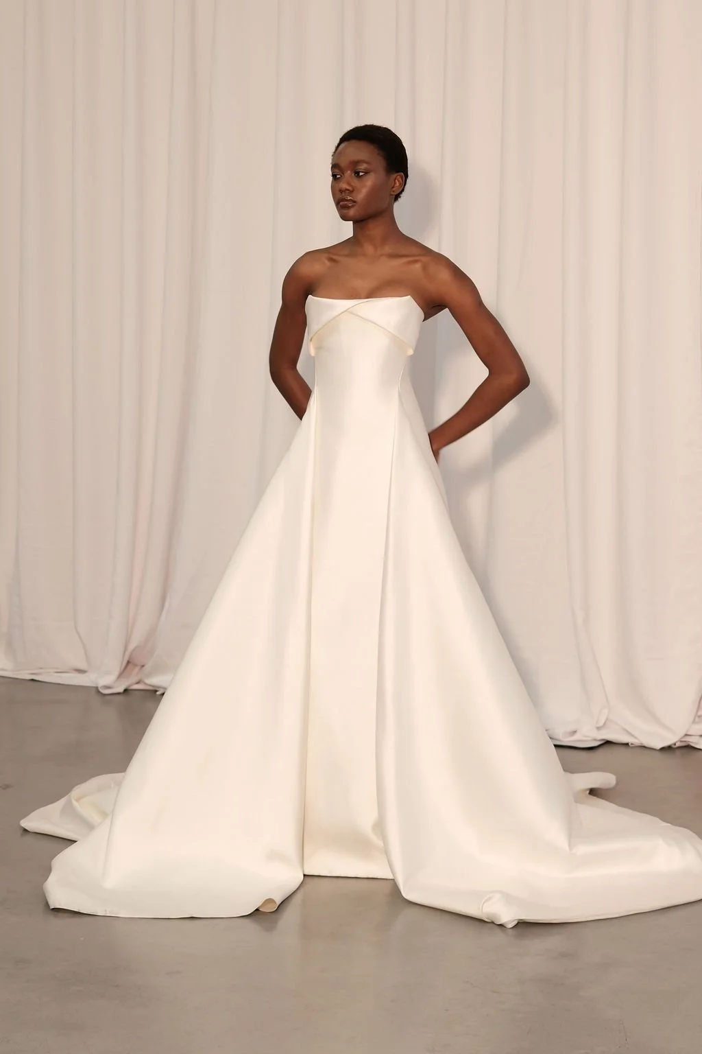 For a go-to for a modern, statement-making look, introducing KYHA Bride Lincoln. A striking silhouette with an unapologetic aesthetic, Lincoln balances technical precision with structural beauty. Cut from lustrous Mikado, Lincoln features a strapless