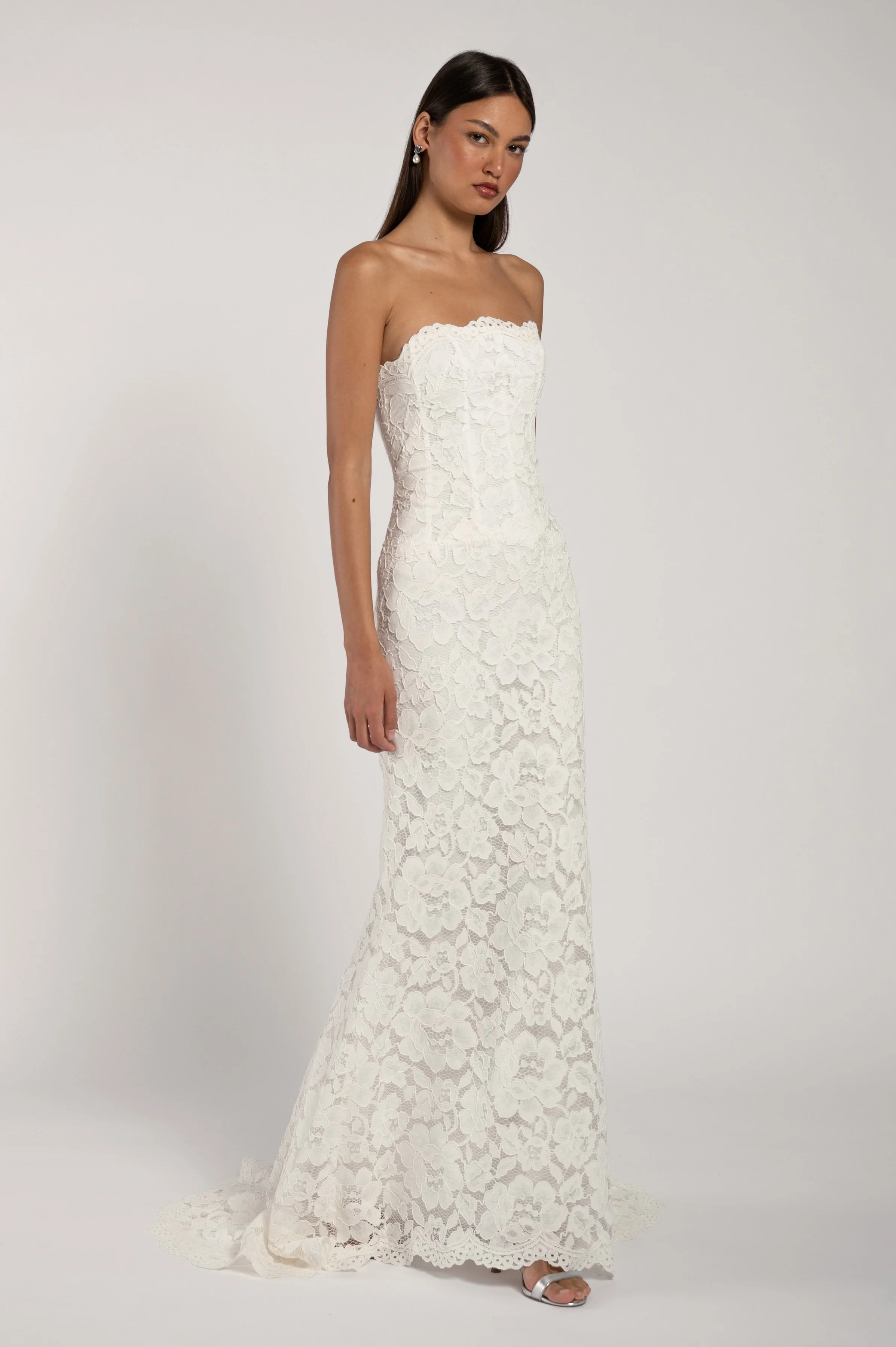 The Jenny Yoo Alyne gown stocked at Halo & Wren Bridal - The Jenny Yoo Bridal Alyne gown is a classic beauty. The corseted bodice wraps gracefully around your shoulders while the dramatic skirt adds romance and drama
