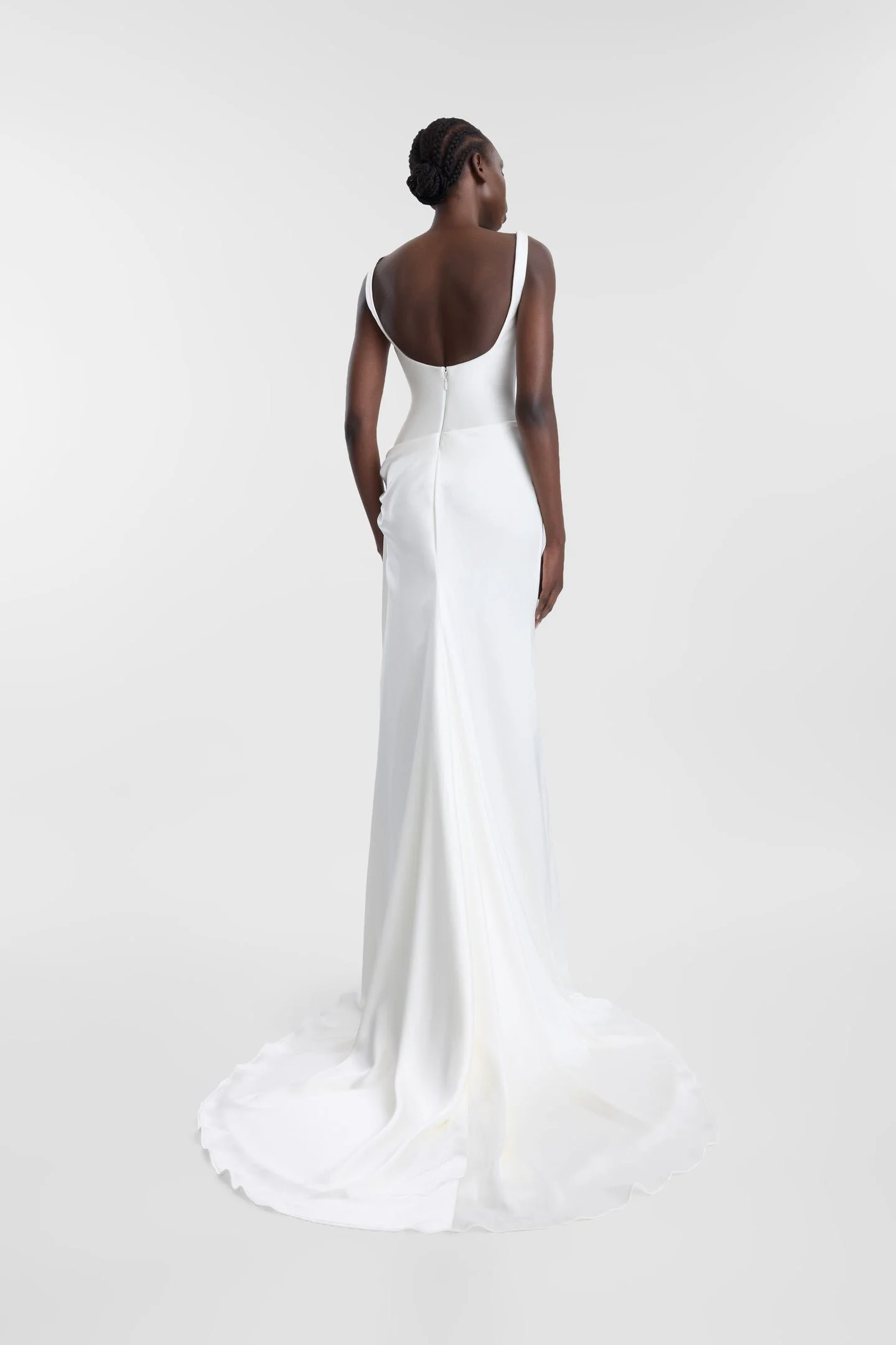 If there is a science to creating an it dress, KYHA Bride Estel has the formula. Crafted from luxe double satin, Estel features a scooped, smooth and structured bodice and skirt that is artfully wrapped across the body in a directional, asymmetric dr