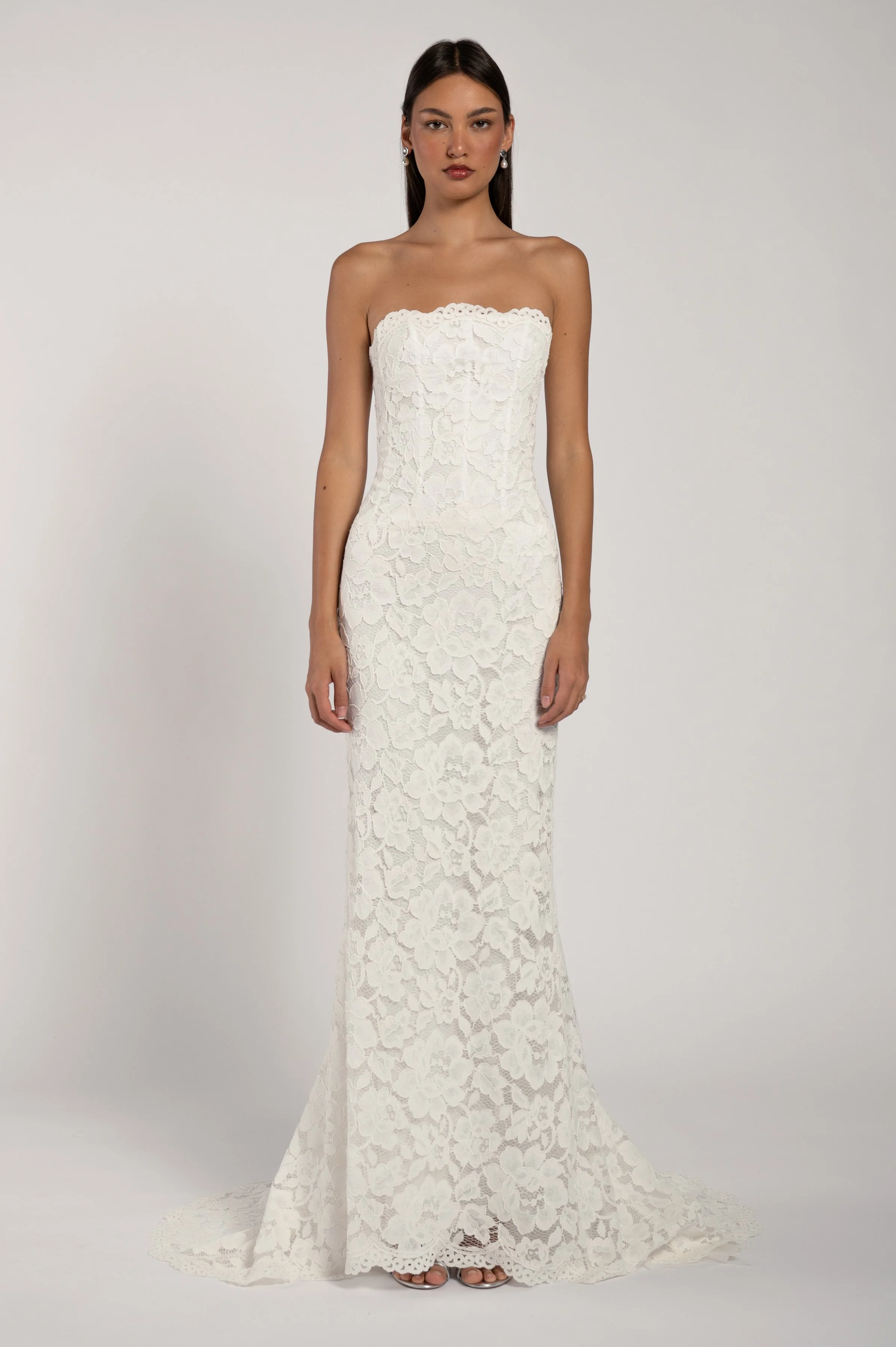 The Jenny Yoo Alyne gown stocked at Halo & Wren Bridal - The Jenny Yoo Bridal Alyne gown is a classic beauty. The corseted bodice wraps gracefully around your shoulders while the dramatic skirt adds romance and drama