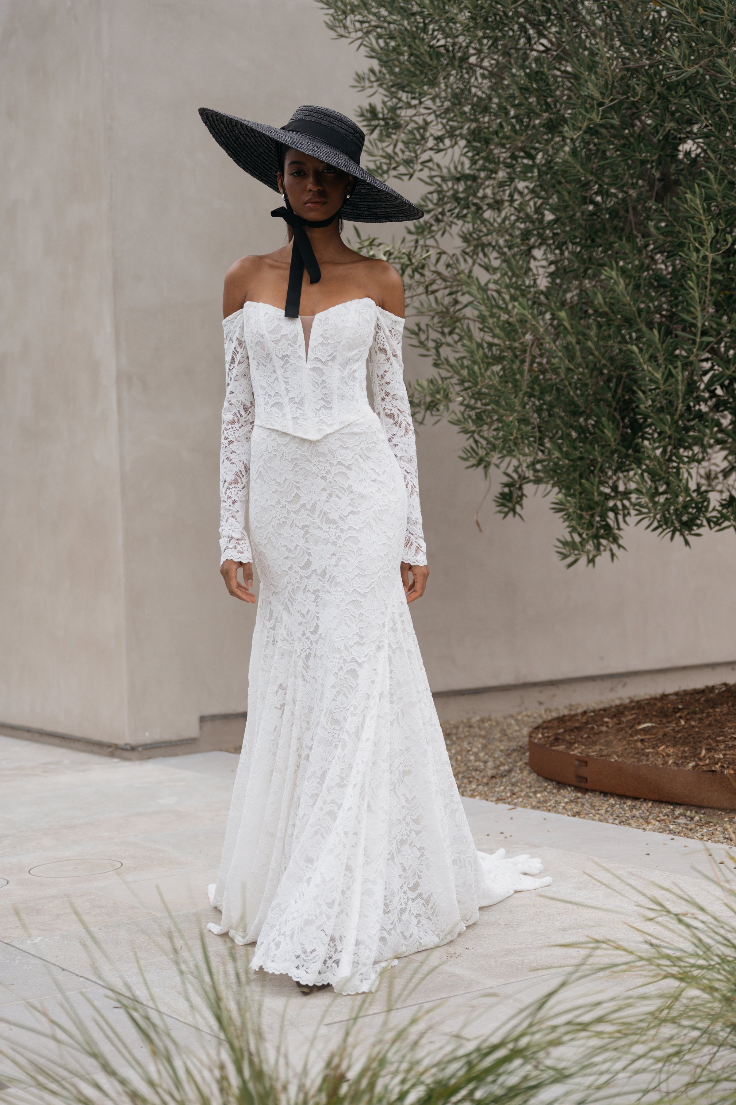 Jenny Yoo Bridal Natalie: The Natalie gown, cut in our beautifully detailed Finley lace, adds a romantic flare to an otherwise modern and sultry silhouette.