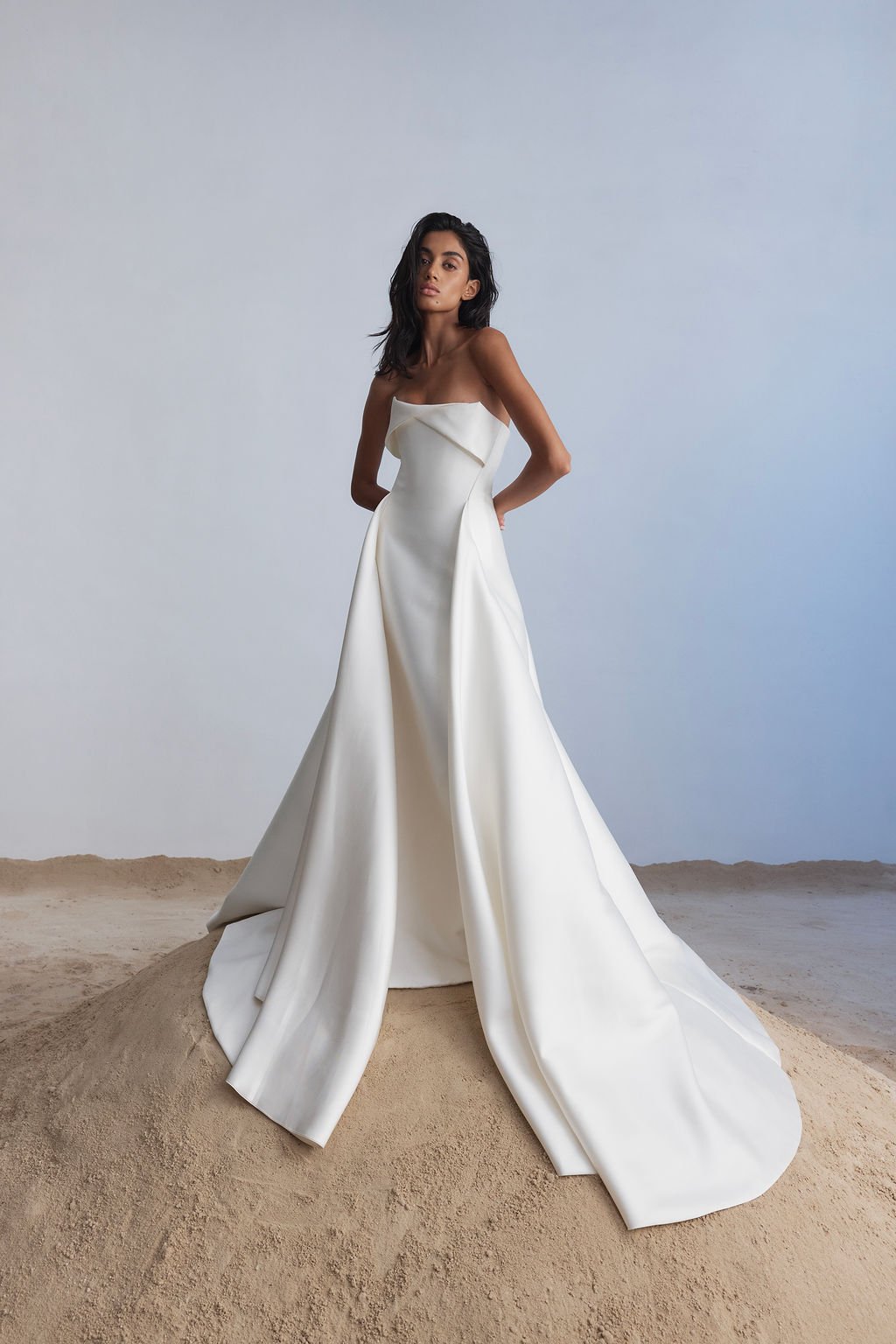 For a go-to for a modern, statement-making look, introducing KYHA Bride Lincoln. A striking silhouette with an unapologetic aesthetic, Lincoln balances technical precision with structural beauty. Cut from lustrous Mikado, Lincoln features a strapless