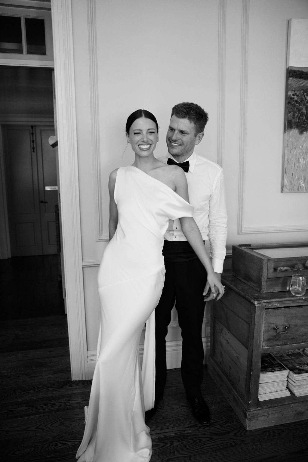 Effortlessness takes the lead in KYHA Bride Arlo. Cut on the bias, liquid double satin falls naturally over the body, delivering nonchalant energy with a distinctly modern edge. A clean, minimal off-shoulder front allows the open back to take centre 