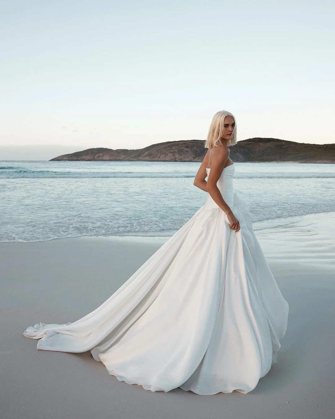 Turn up the volume - and turn heads - in KYHA Bride Lucky.  Modern couture meets eighties details thanks to Lucky’s structured, draped drop waist bodice and gathered, full skirt. Crafted from luxe duchess, Lucky is a sartorial showstopper.