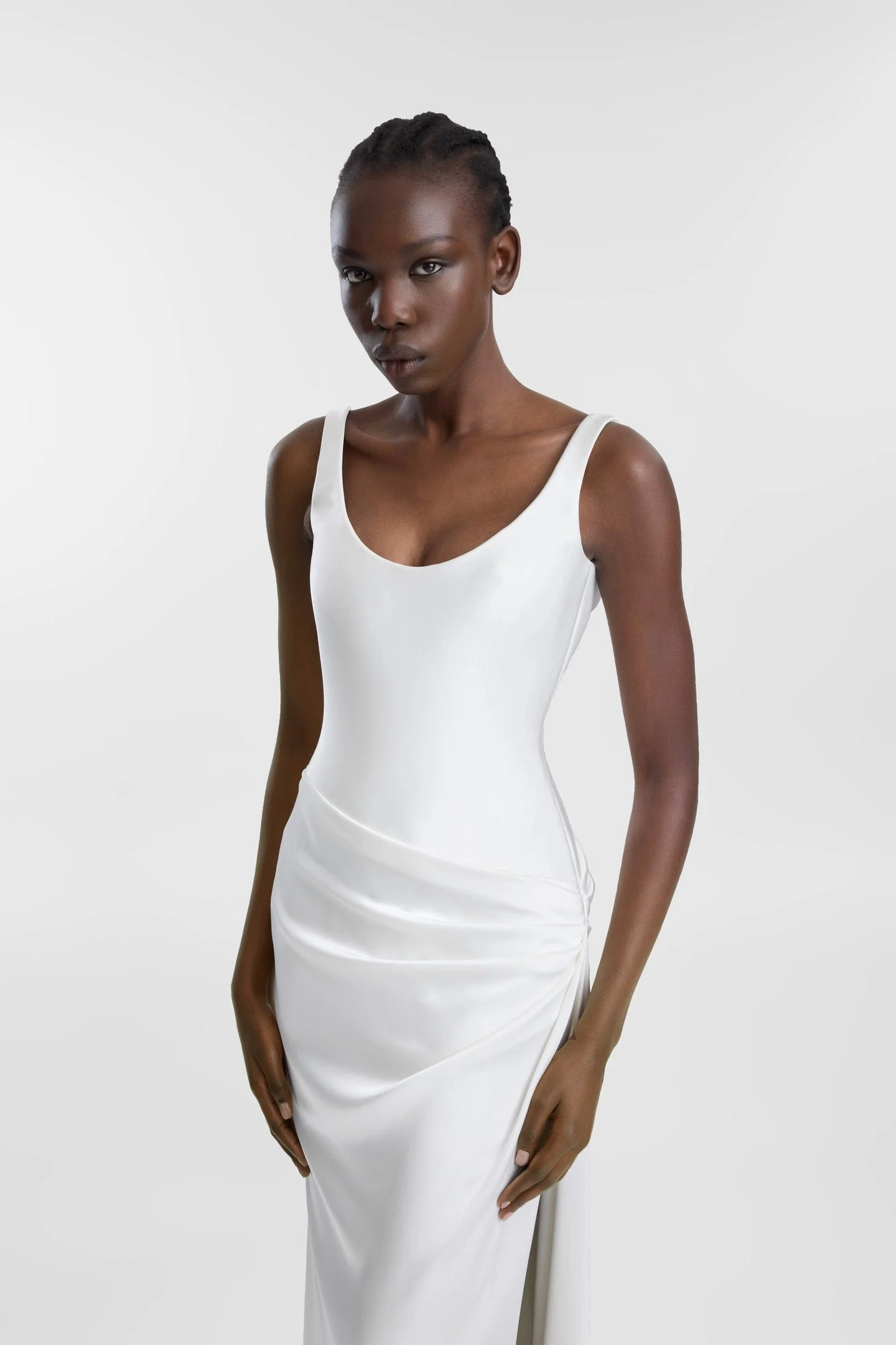 If there is a science to creating an it dress, KYHA Bride Estel has the formula. Crafted from luxe double satin, Estel features a scooped, smooth and structured bodice and skirt that is artfully wrapped across the body in a directional, asymmetric dr