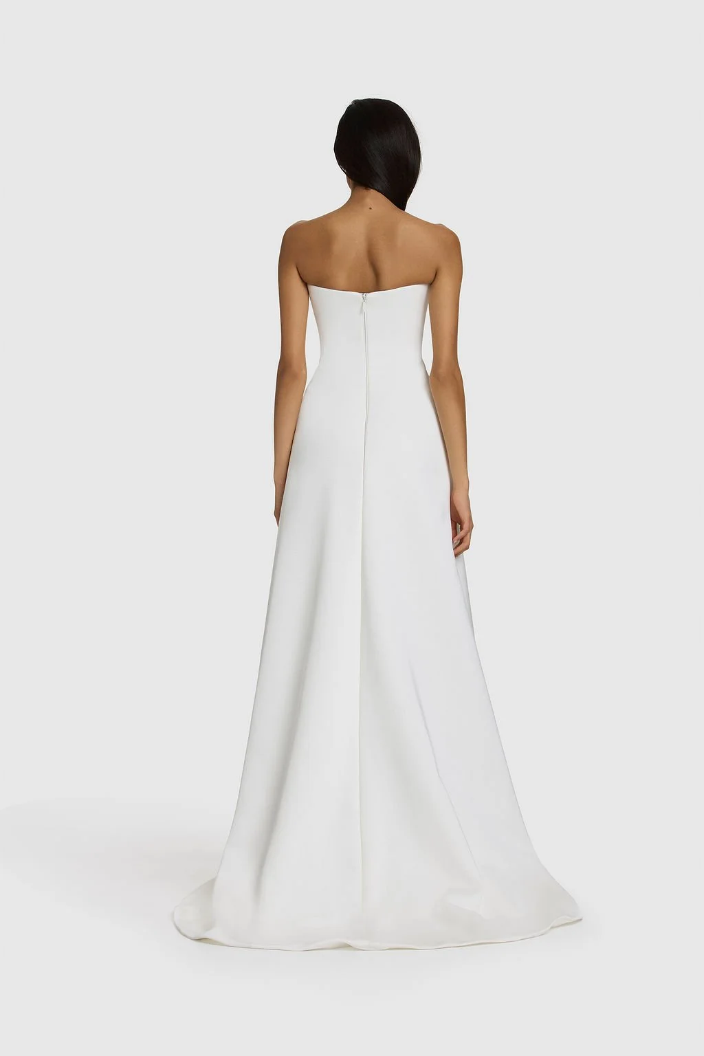 A work of art in KYHA Bride Walkley. Cut from fluid triacetate with a hint of stretch, Walkley’s A-line silhouette features a corseted bodice and liquid-like skirt that gracefully trails behind. The architectural hip detail combining sculptural shapi