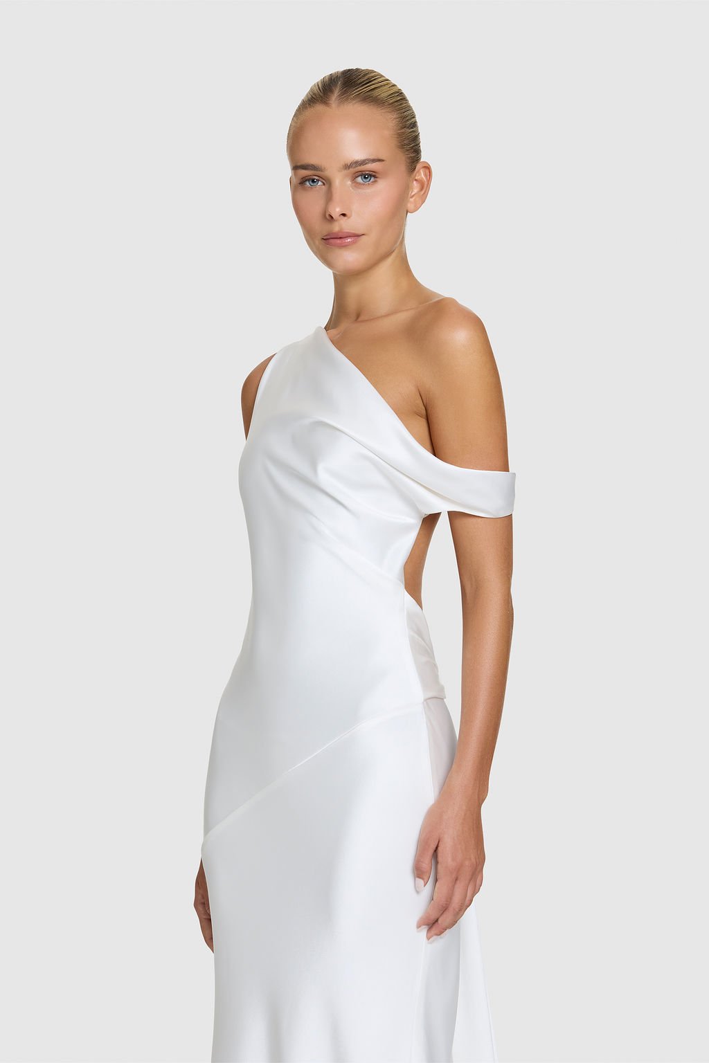 Effortlessness takes the lead in KYHA Bride Arlo. Cut on the bias, liquid double satin falls naturally over the body, delivering nonchalant energy with a distinctly modern edge. A clean, minimal off-shoulder front allows the open back to take centre 