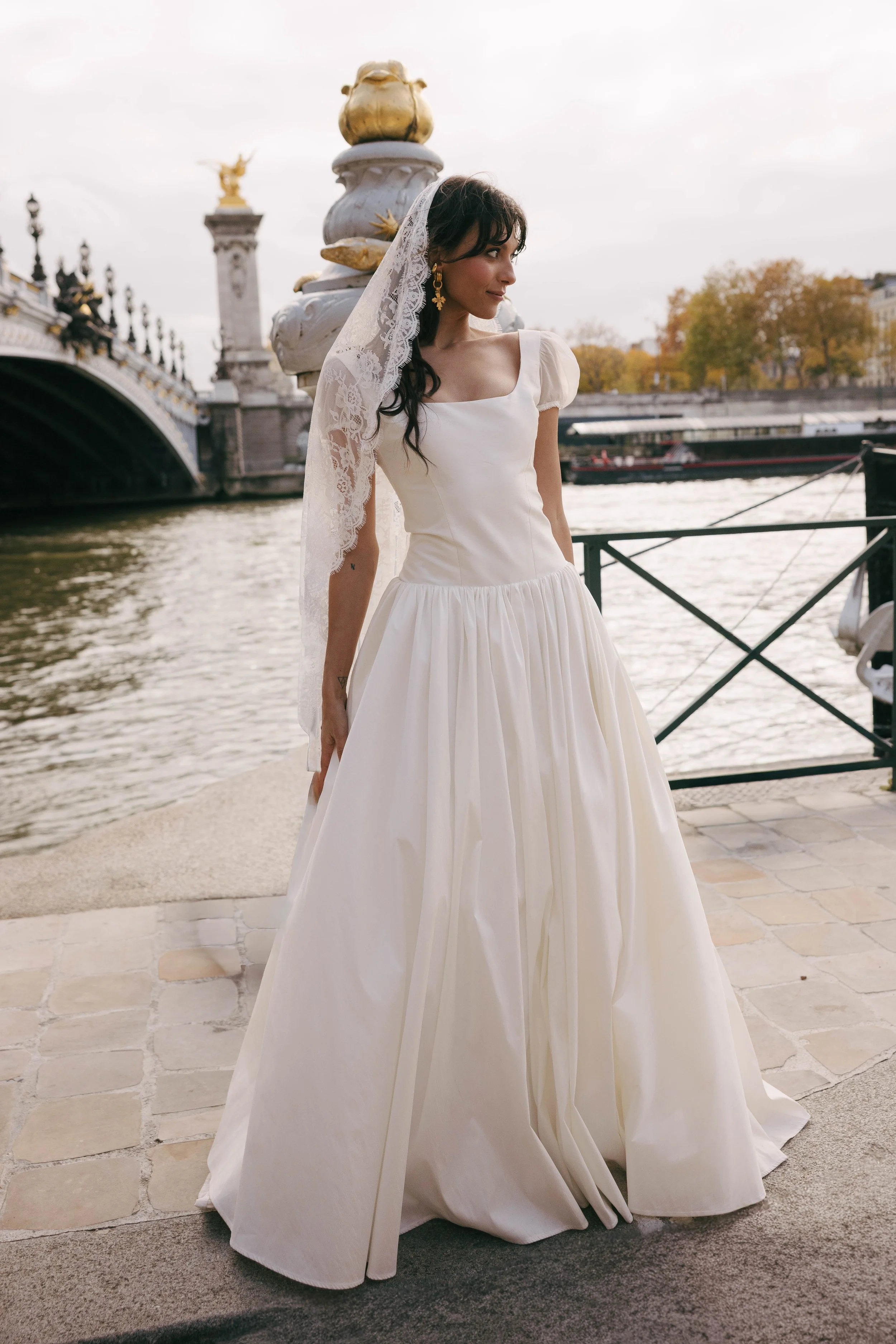 The & For Love Bridal Degas gown is a cool, fashion-forward bridal statement designed to redefine modern wedding style. With its sleek silhouette, avant-garde detailing, and elevated design edge, this gown delivers contemporary attitude without sacri