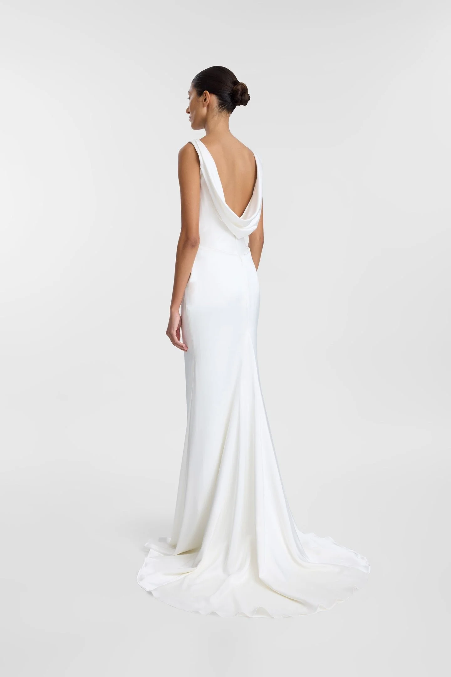 A love letter to 90s minimalism, KYHA Bride Llume is a structured take on a classic slip, Llume masters the art of draping, using organic folds across the scoop neckline, waist and hip, both bouncing light and accentuating the female form. Crafted fr