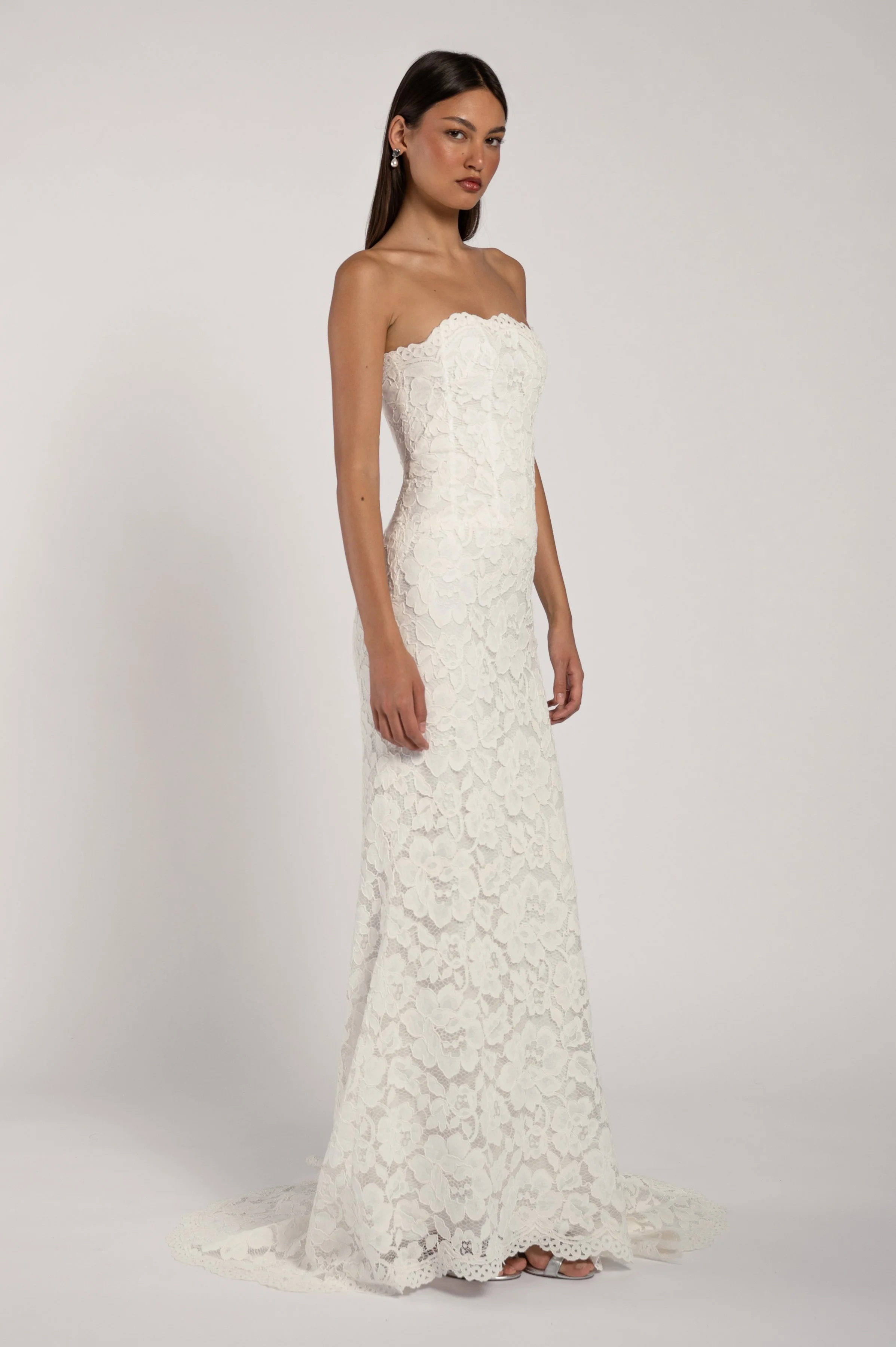 The Jenny Yoo Alyne gown stocked at Halo & Wren Bridal - The Jenny Yoo Bridal Alyne gown is a classic beauty. The corseted bodice wraps gracefully around your shoulders while the dramatic skirt adds romance and drama