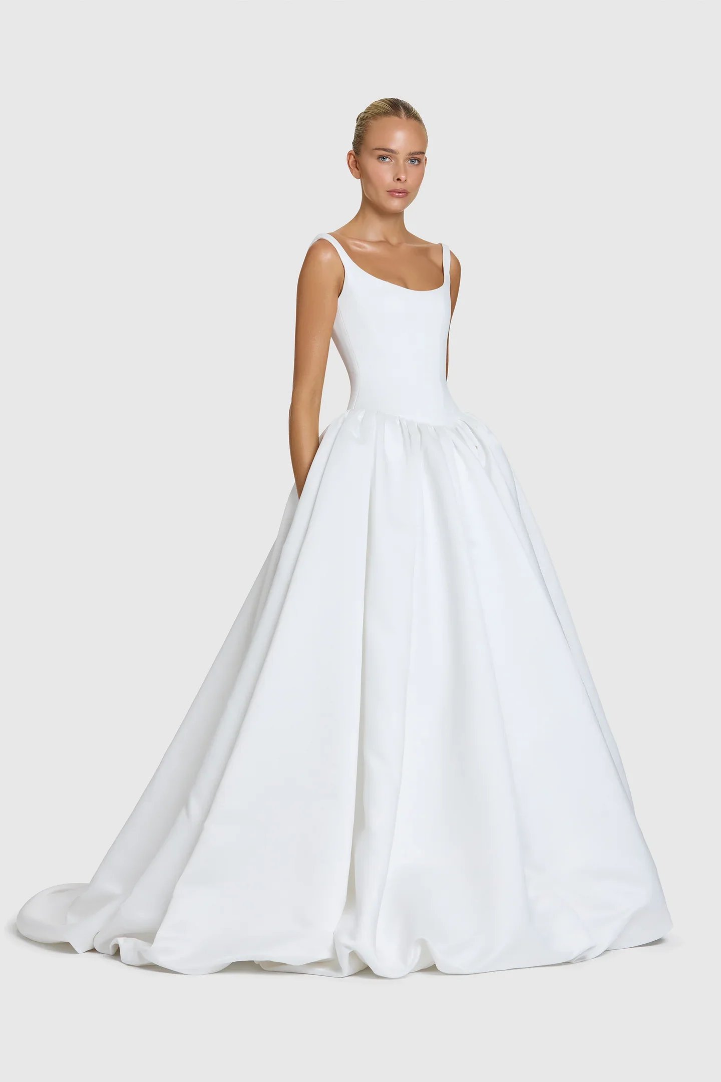 You’re a powerful presence in KYHA Bride Emery. A fresh take of a timeless silhouette, Emery balances sculpted precision with cloud-like airiness. A scoop-neck, corseted bodice flows into a gathered skirt, embodying KYHA’s signature play on structure