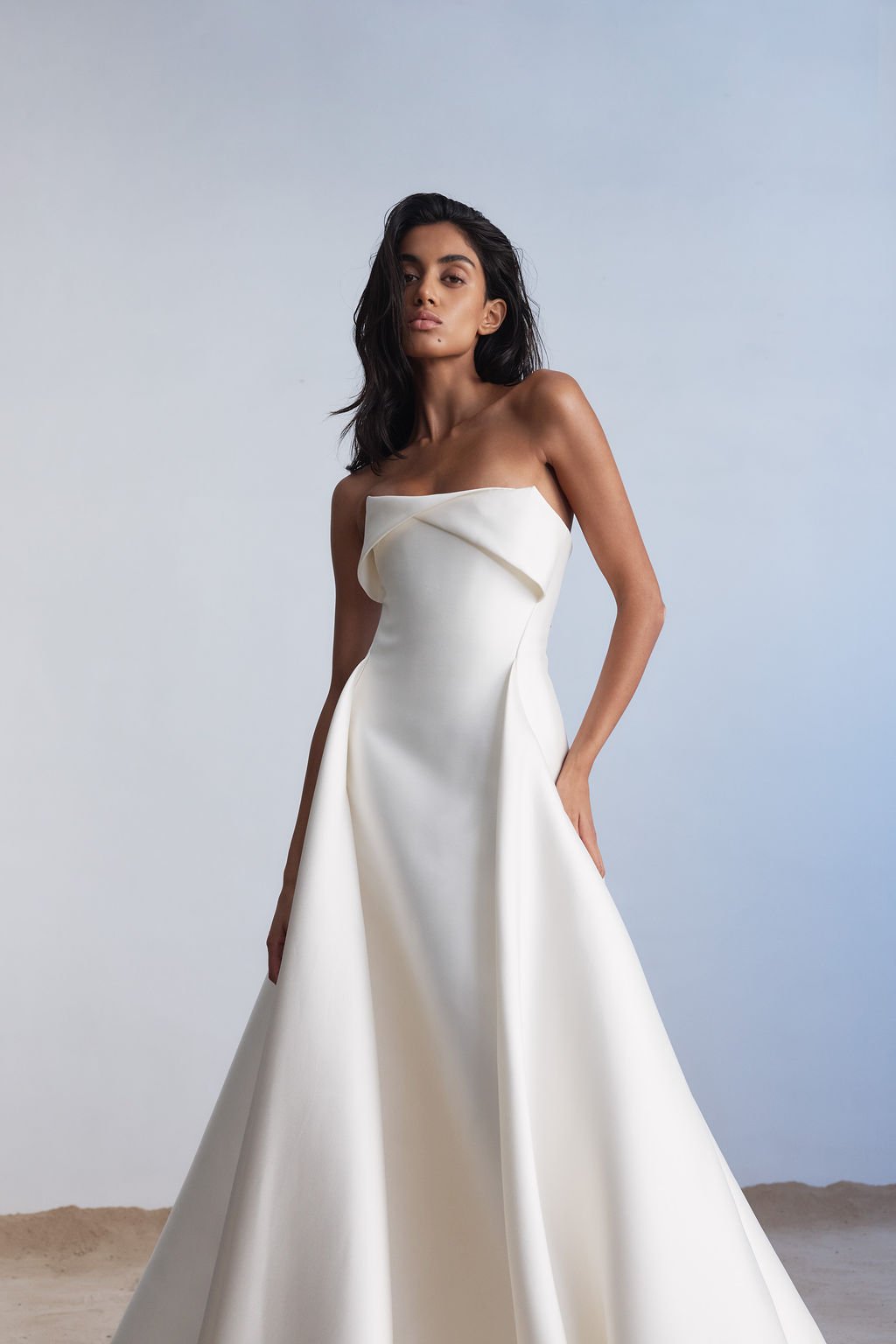 For a go-to for a modern, statement-making look, introducing KYHA Bride Lincoln. A striking silhouette with an unapologetic aesthetic, Lincoln balances technical precision with structural beauty. Cut from lustrous Mikado, Lincoln features a strapless