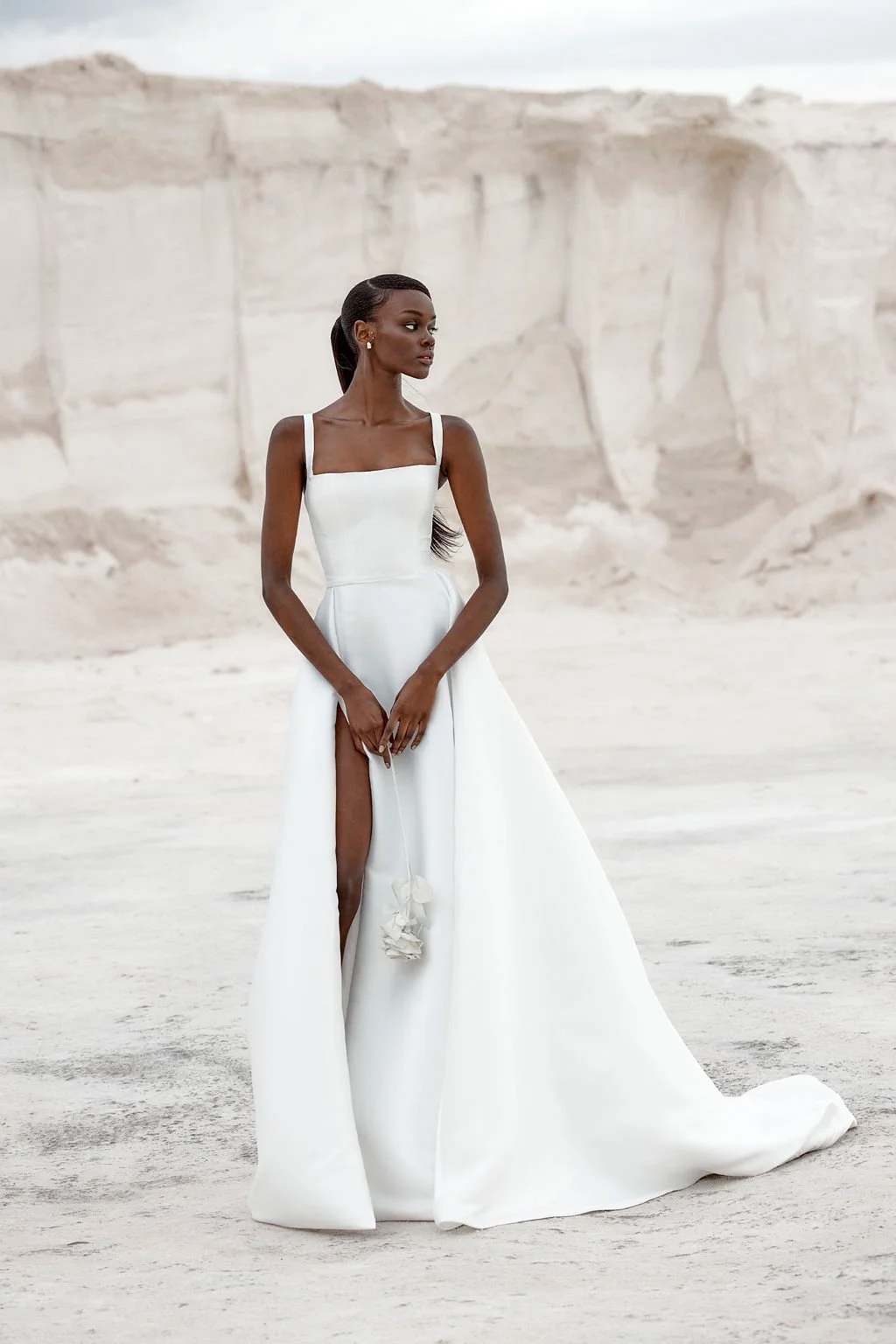 Set the dial to high drama when KYHA Bride Luni enters the room. Maximalism made for minimalists, Luni combines a structured, scoop neck bodice with swathes of luminous duchess satin in a full skirt. Add a split to keep things fresh, and suddenly you