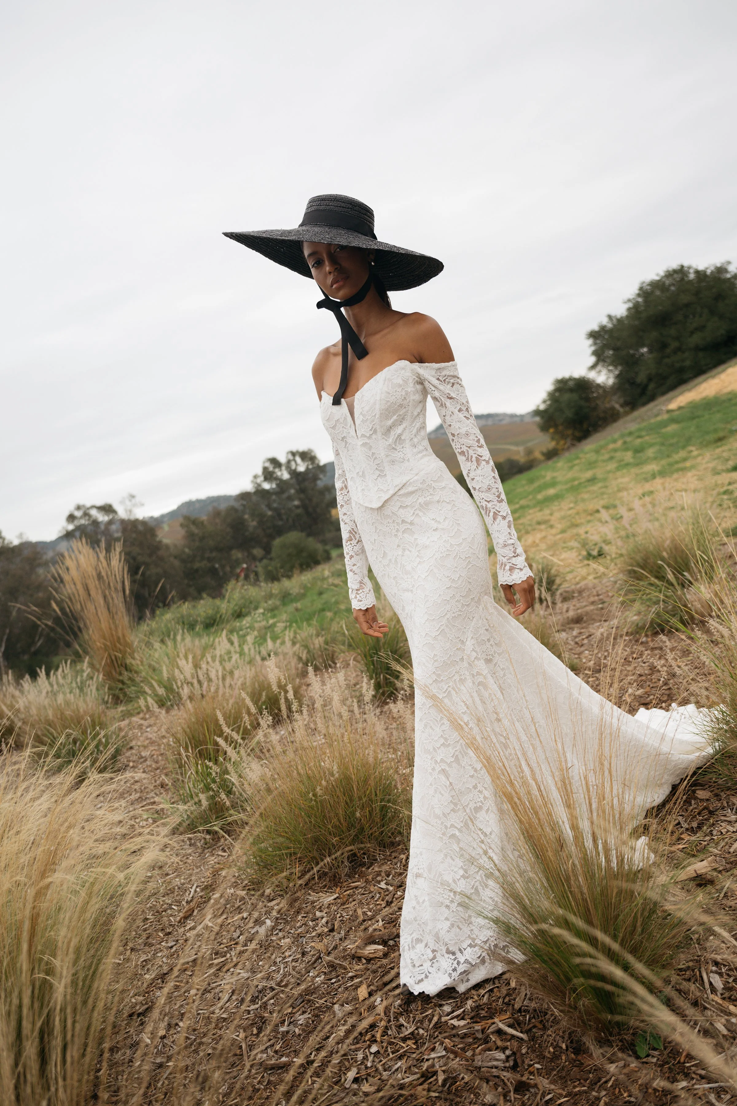 Jenny Yoo Bridal Natalie: The Natalie gown, cut in our beautifully detailed Finley lace, adds a romantic flare to an otherwise modern and sultry silhouette.