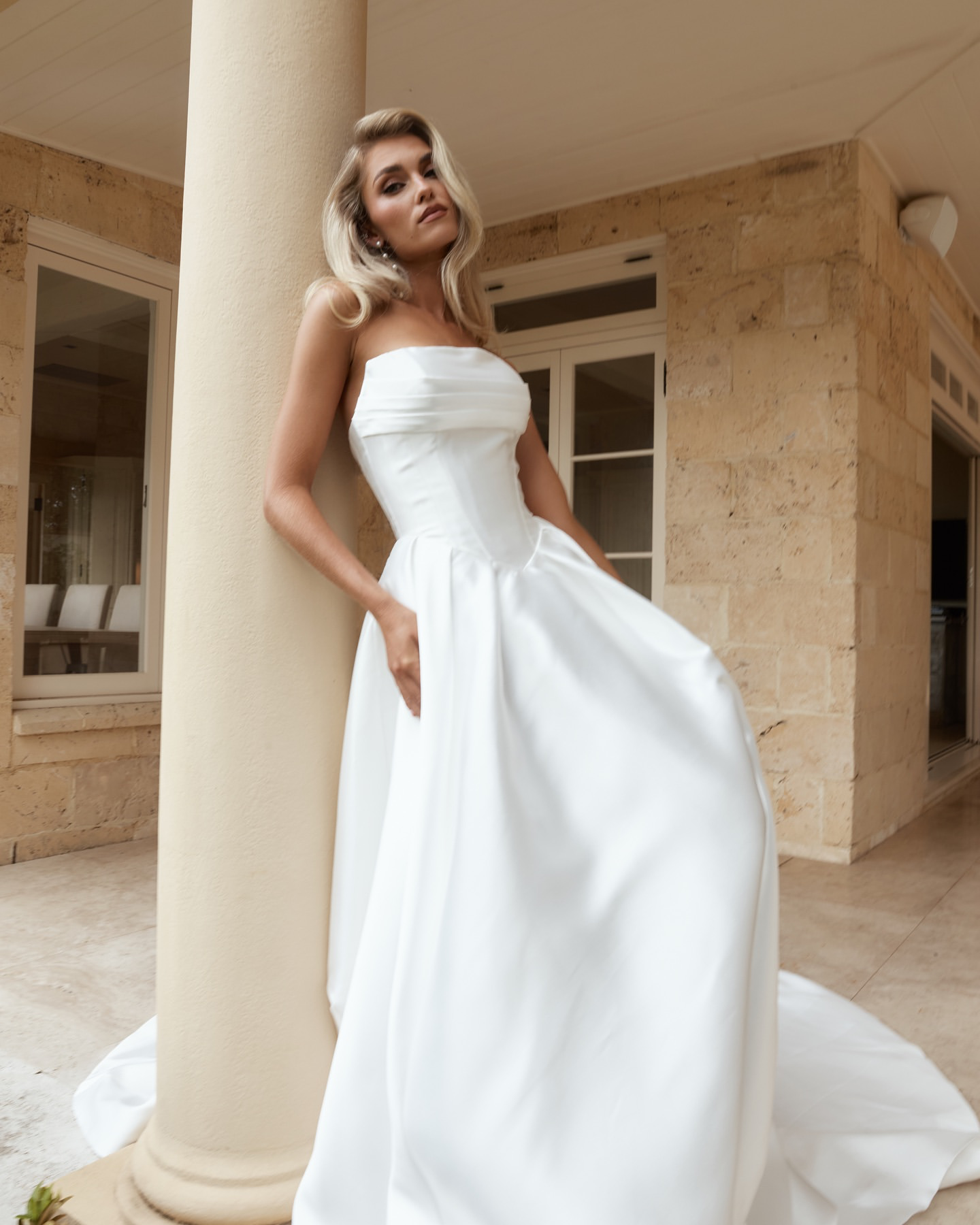 Jane Hill Bridal Anderson timeless meets modernity in Anderson. with a flattering elongated v-shaped corset and clean straight neckline, this gown is finished with our voluminous signature skirt in luxe mikado