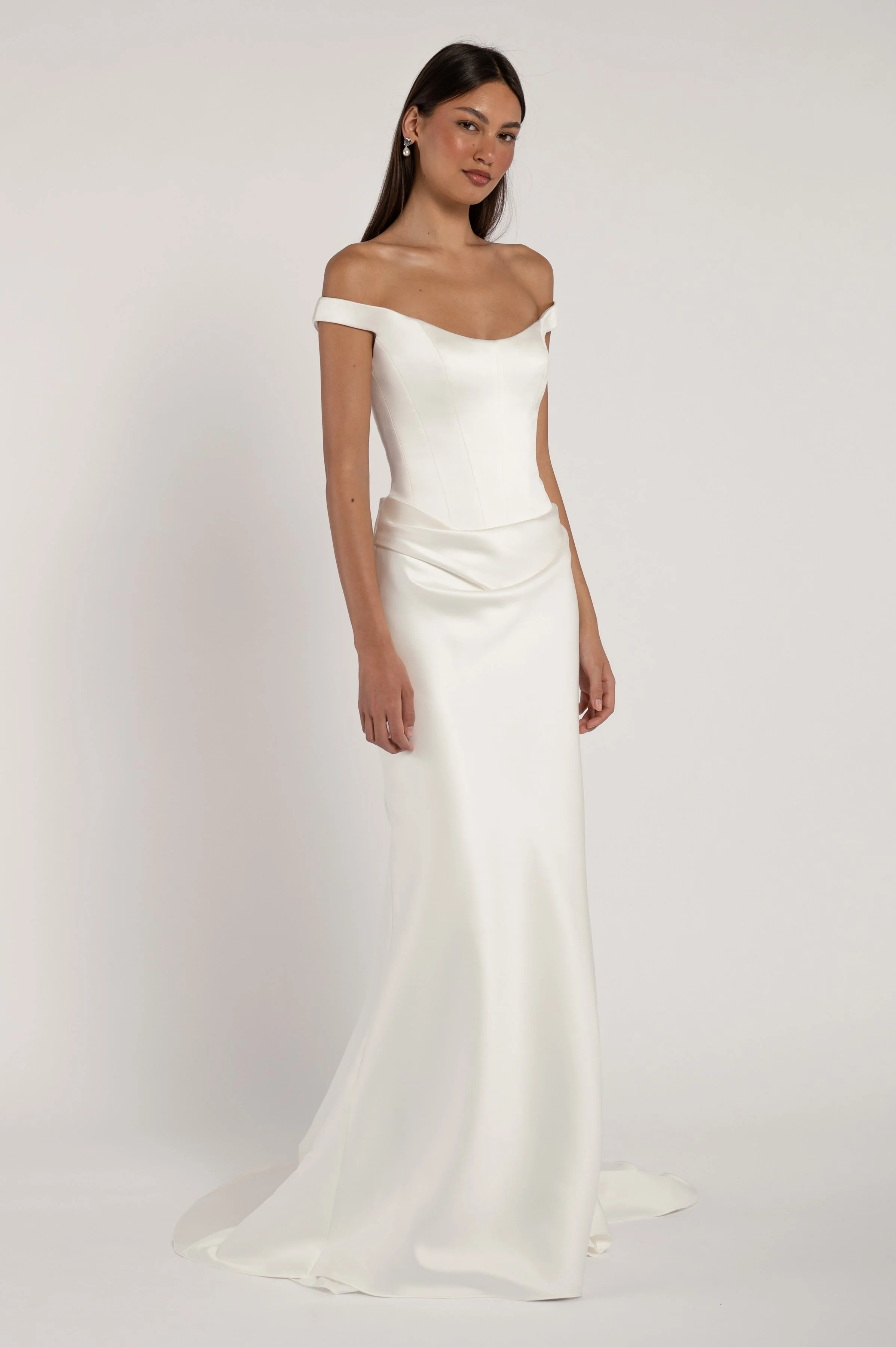 The Elisa gown takes vintage inspiration and molds it into a totally modern silhouette. Corseted structure meets draped softness for a look that is sultry yet romantic.