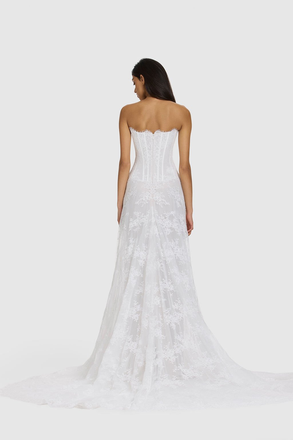 Quiet drama reimagined in KYHA Bride Mimi. Lace without the noise, Mimi's silhouette is deliberately spare. A structured, strapless corset sees sheer lace panels layer over chiffon, casting soft contrast against warm shell for a fresh yet understated