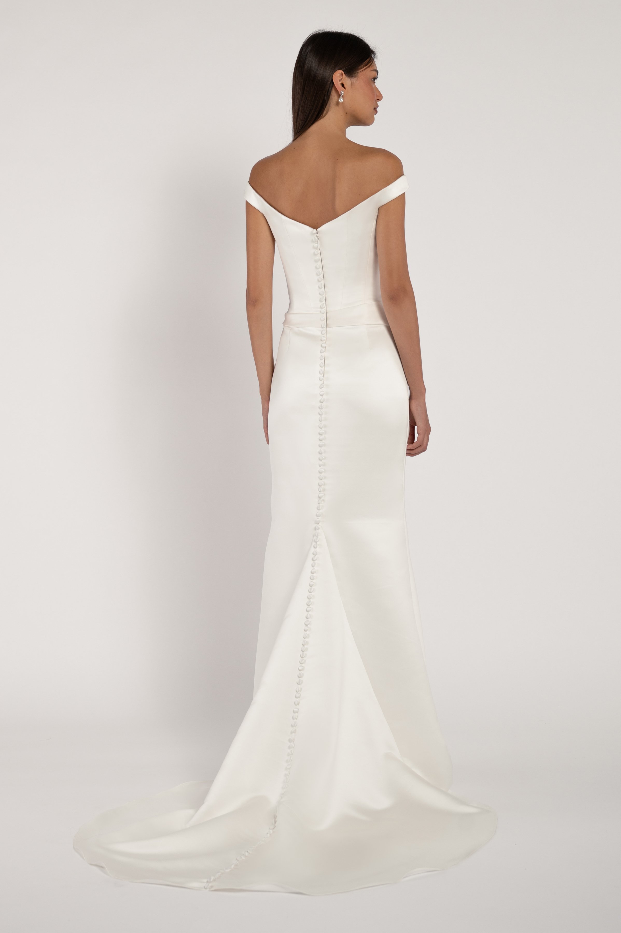 The Elisa gown takes vintage inspiration and molds it into a totally modern silhouette. Corseted structure meets draped softness for a look that is sultry yet romantic.