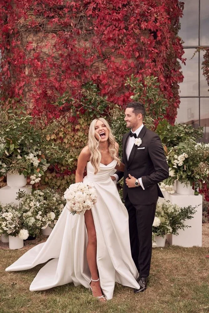 The iconic Mariana Hardwick Chantelle bridal gown, Chantelle's wedding dress, the Chantelle gown, featured a full, billowing skirt with dramatic train, and elegantly draped fabric with accentuated peaks at the neckline.