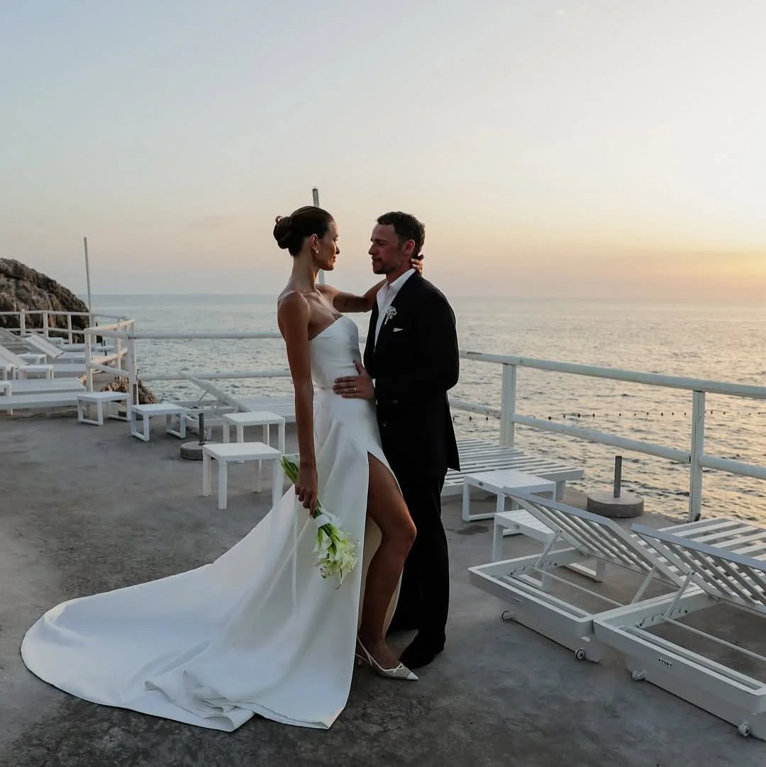 DETAILS - fit check with KYHA bride Ellery? expect minimalism with maximum impact. Ellery delivers a flawless fit thanks to its highly structured bodice, a deliberate contrast to its pared back, straight neckline and effortless drape detail. crafted 