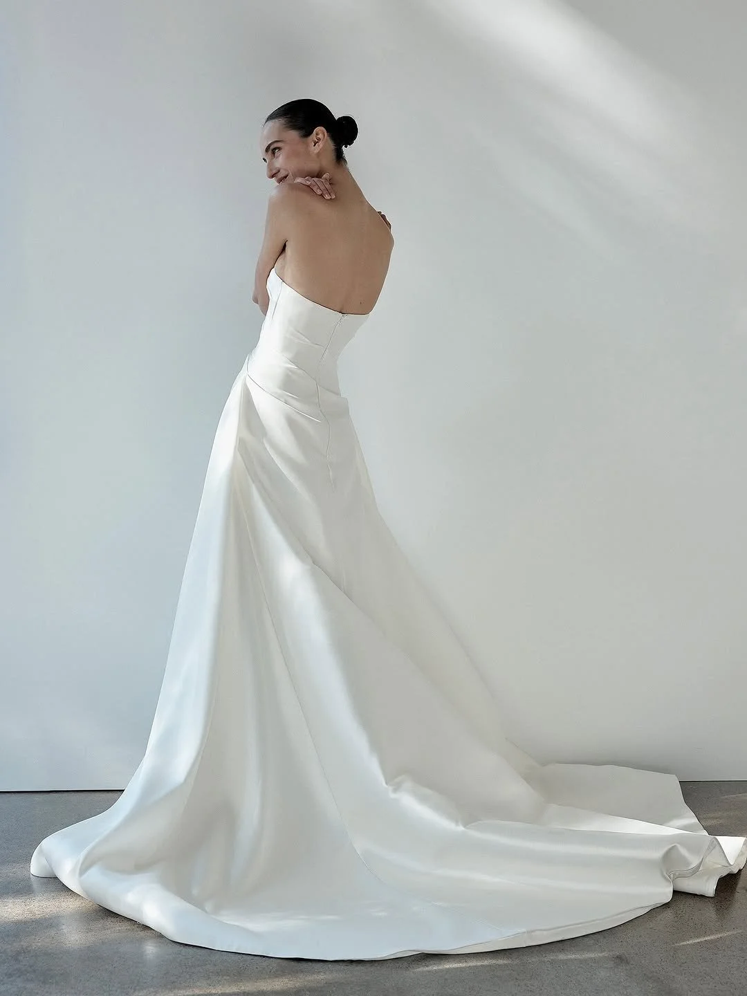 DETAILS - fit check with KYHA bride Ellery? expect minimalism with maximum impact. Ellery delivers a flawless fit thanks to its highly structured bodice, a deliberate contrast to its pared back, straight neckline and effortless drape detail. crafted 