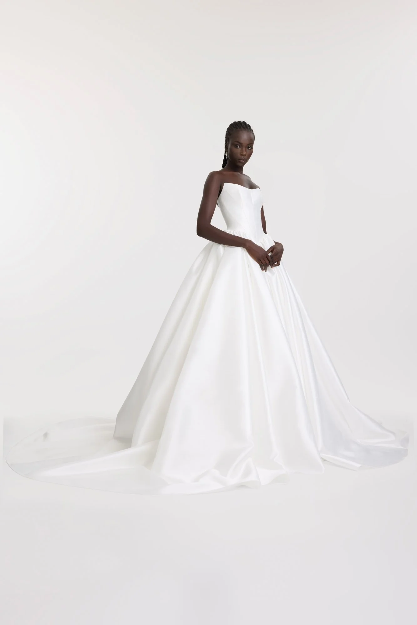 Dress like the queen that you are c/o KYHA Bride Miles. Crafted from a luxe woven taffeta, a gathered Basque waistline accentuates an hourglass shape made modern via a softly scooped neckline. Drama reigns supreme via the ballgown skirt, making Miles