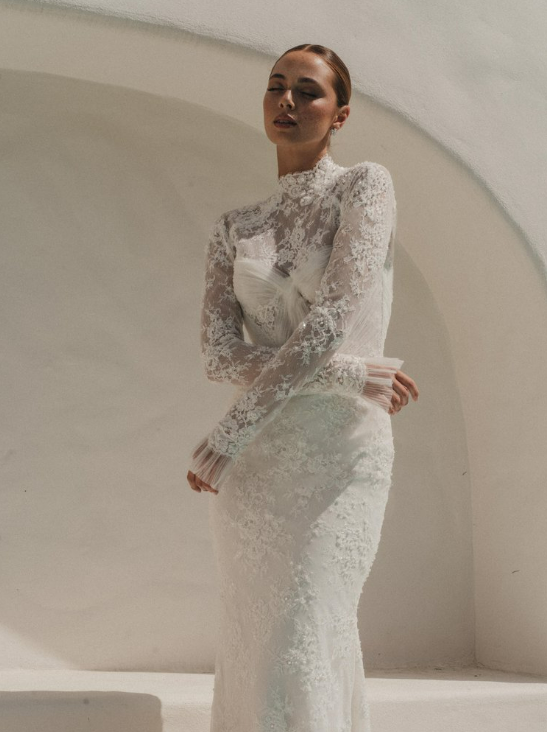 Alena Leena Bridal Rubinette available at Halo & Wren Bridal

The Rubinette gown is demurely flirtatious with a hint of seduction. A structured bustier is softened by swathes of lace, and hints of sparkle shine as you move.

Perfect for the bride loo