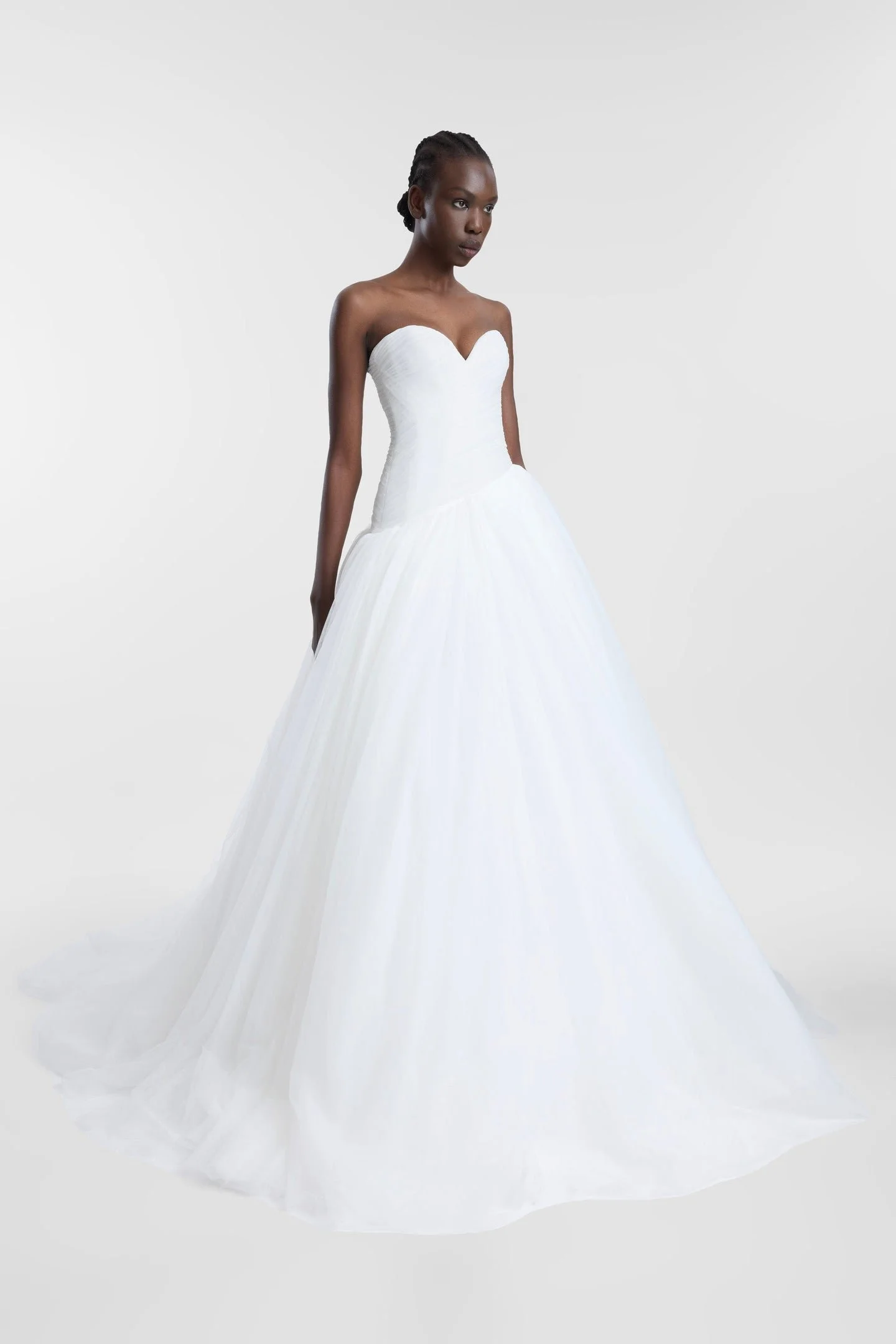 A lesson in soft layering via Pippi. Celebrating the female form in swathes of ivory tulle, Pippi delivers high impact thanks to its striking ballgown silhouette, sweetheart neckline and textured draping at the waistline. Rewriting the bridal codes o