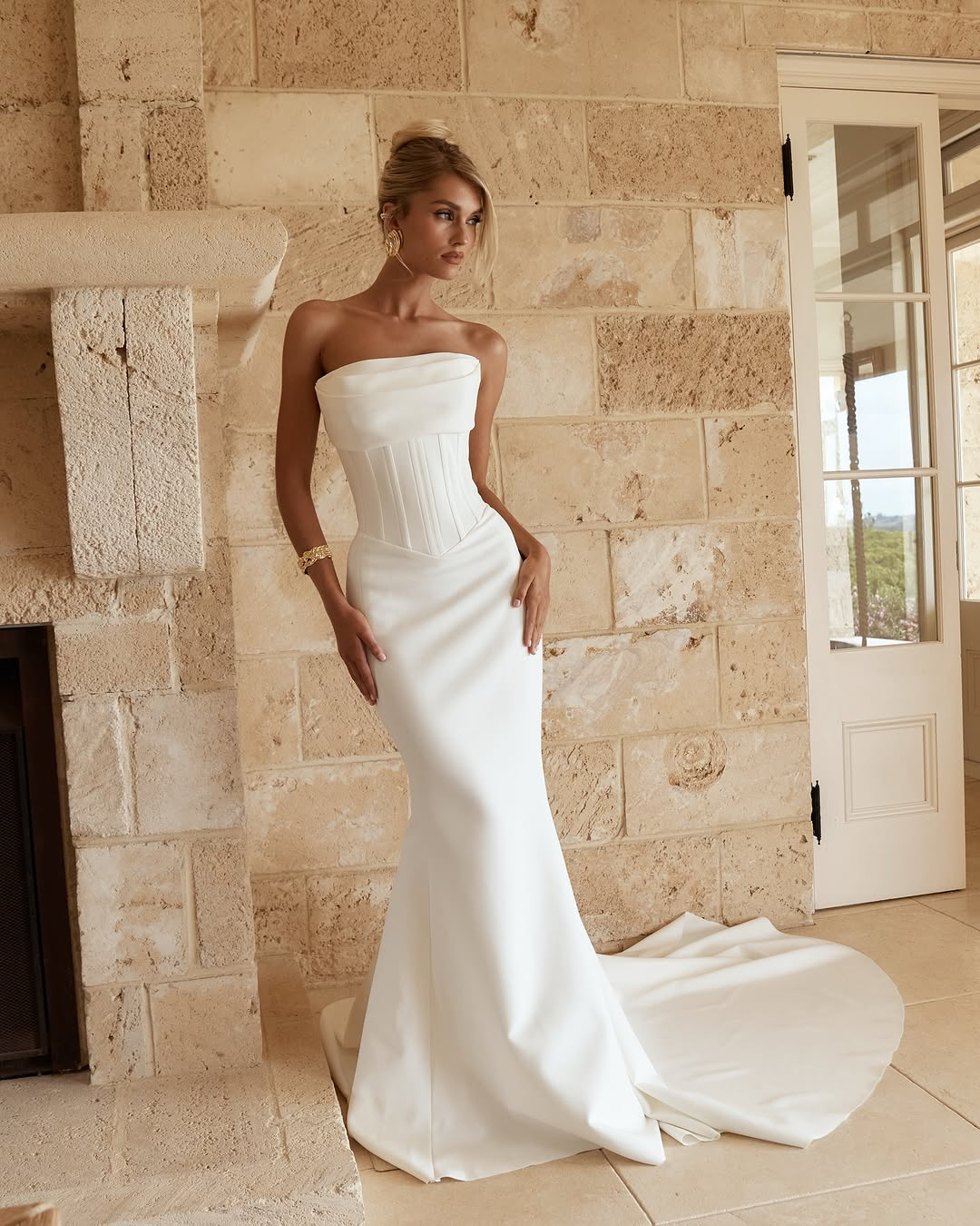 Jane Hill Bridal Benni sculpted for the modern bride, Benni features our signature fit-and-flare silhouette with a slight drop waist and a flattering straight neckline with bust detailing. this structured gown elongates the body while highlighting th