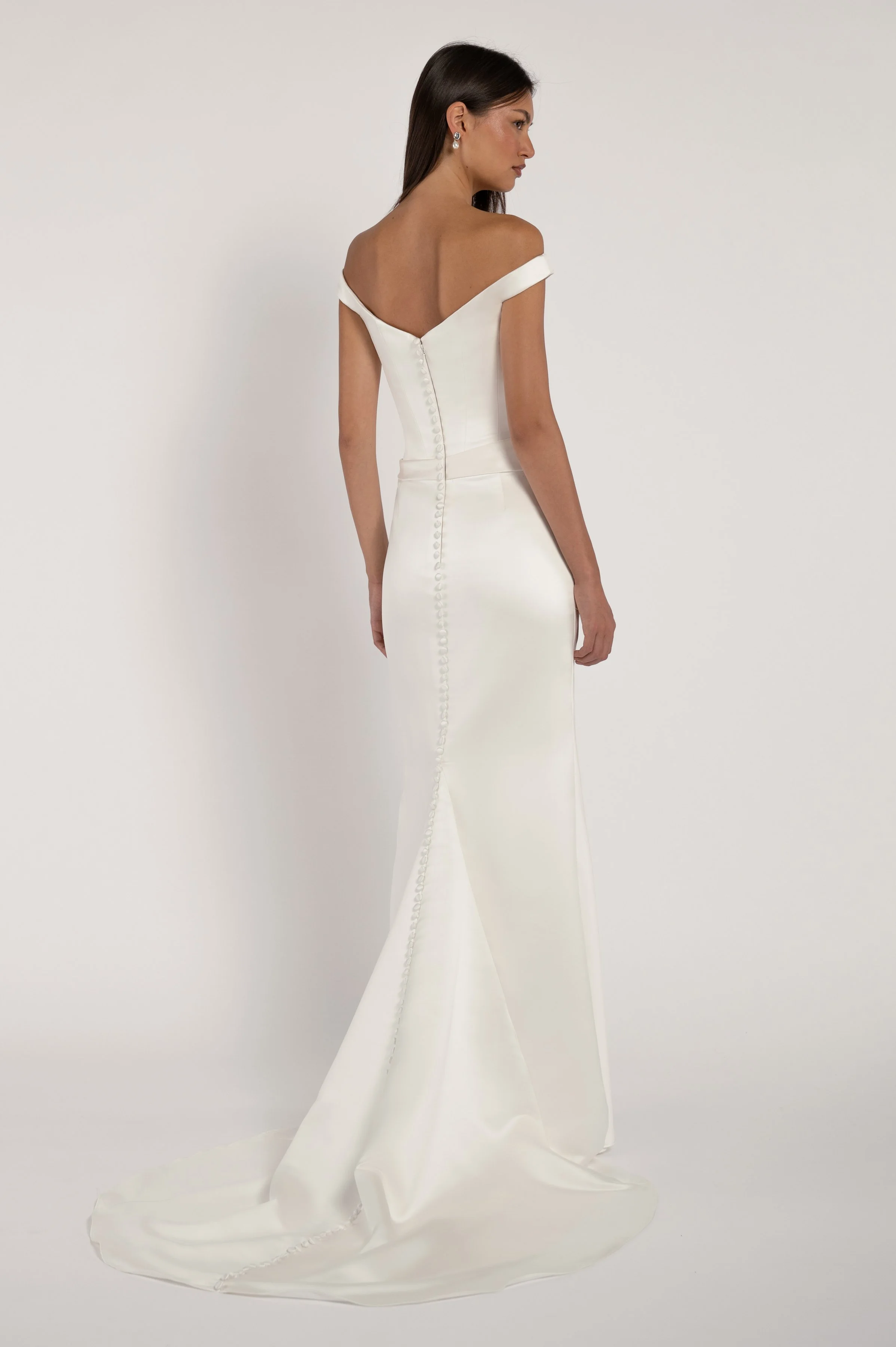 The Elisa gown takes vintage inspiration and molds it into a totally modern silhouette. Corseted structure meets draped softness for a look that is sultry yet romantic.